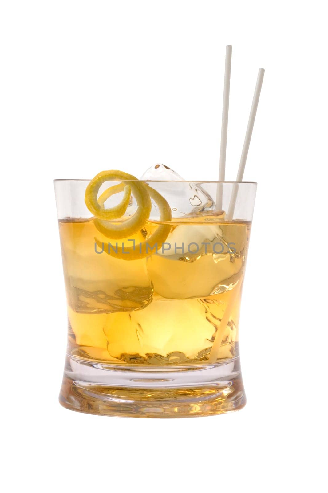 Scotch and water on the rocks with lemon peel garnish on white background