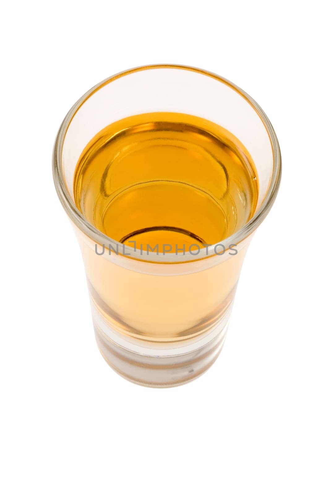 Whiskey neat in shot glass on white background