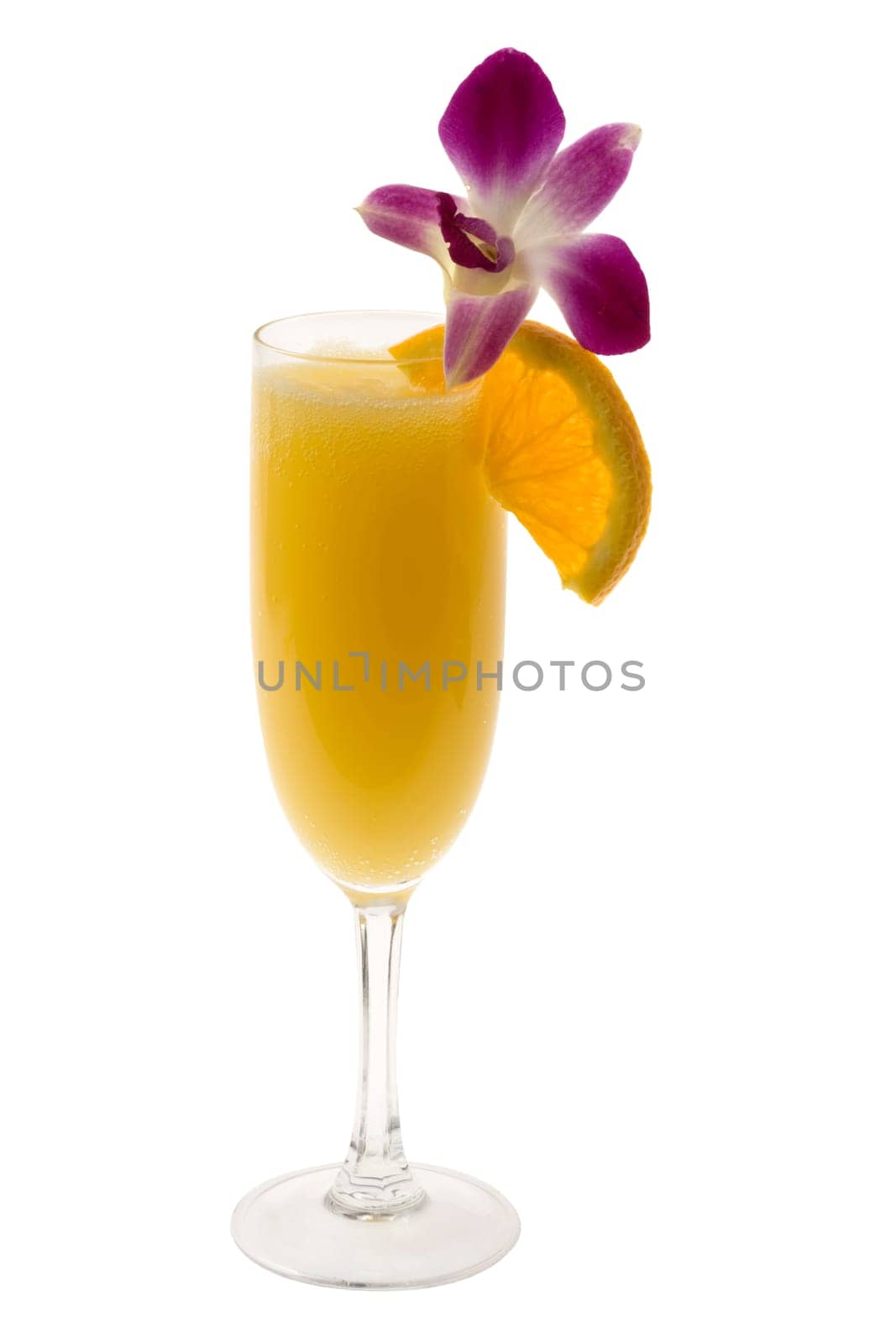 Mimosa mixed drink with orange slice and orchid garnish on a white background