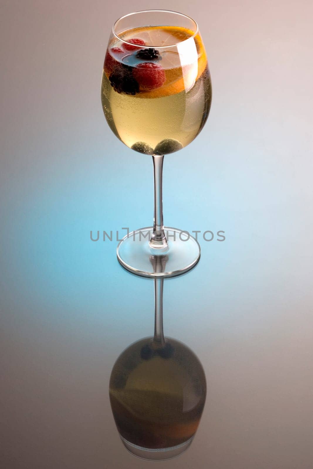 Glass of white wine sangria on grey background with reflection