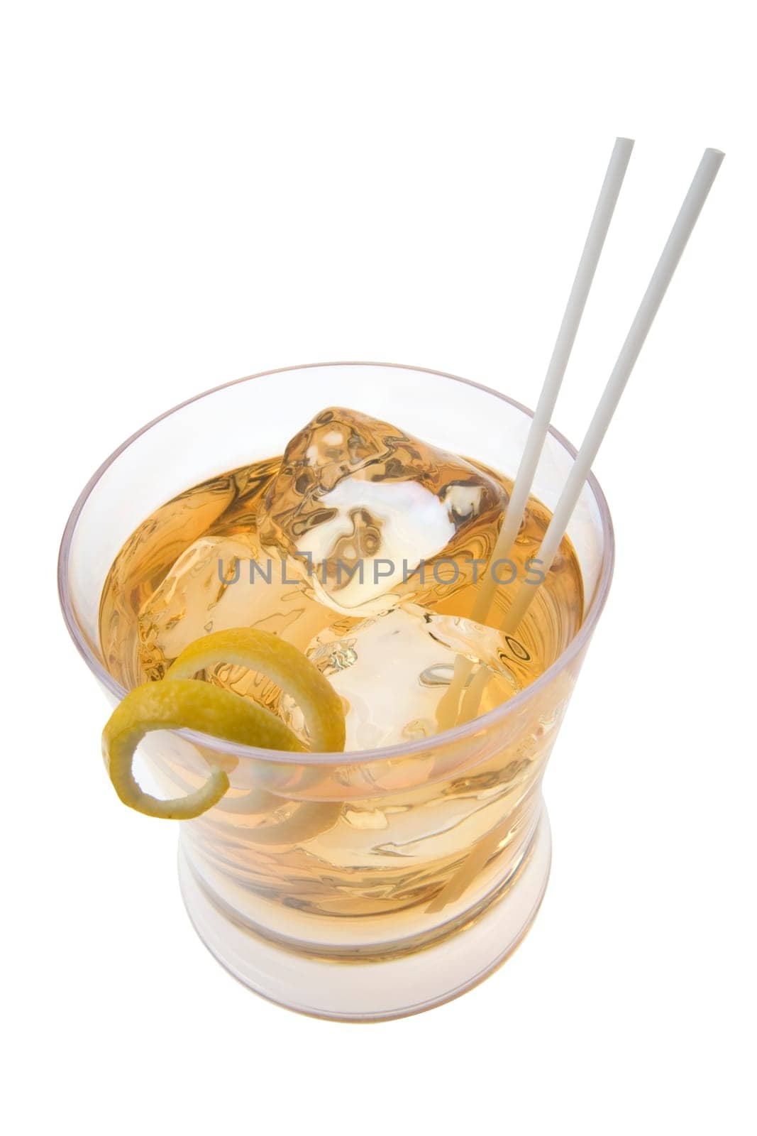 Scotch and water on the rocks with lemon peel garnish on white background