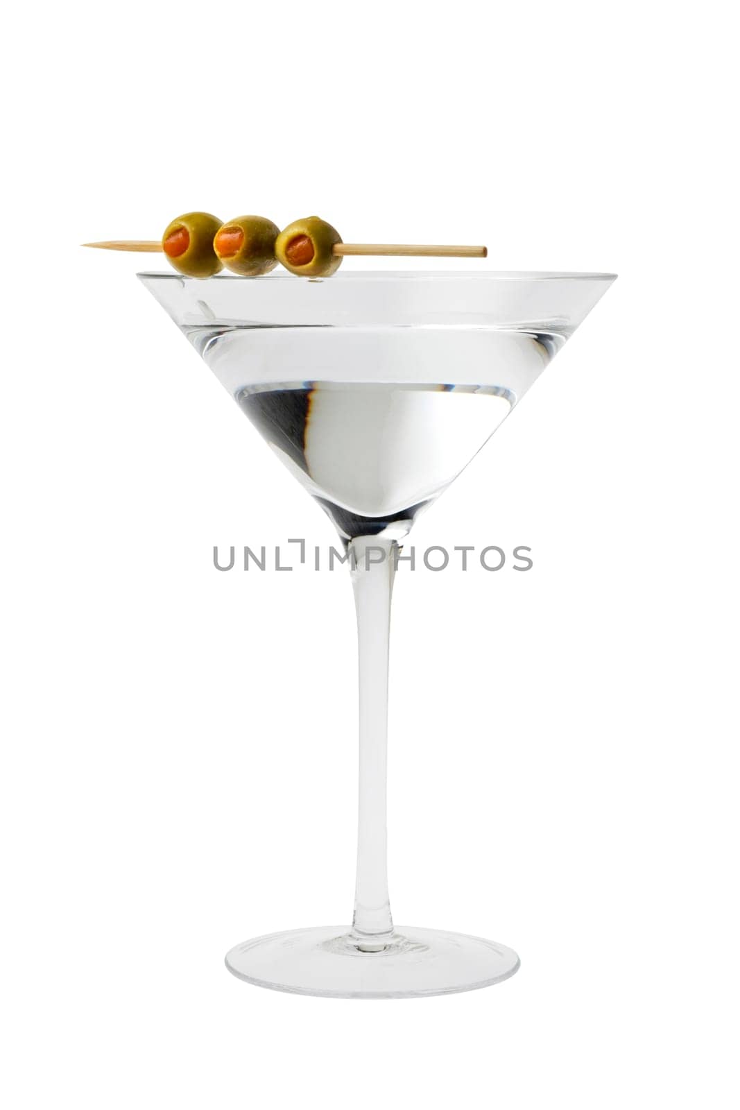 Martini mixed drink with olive garnish on a white background close up