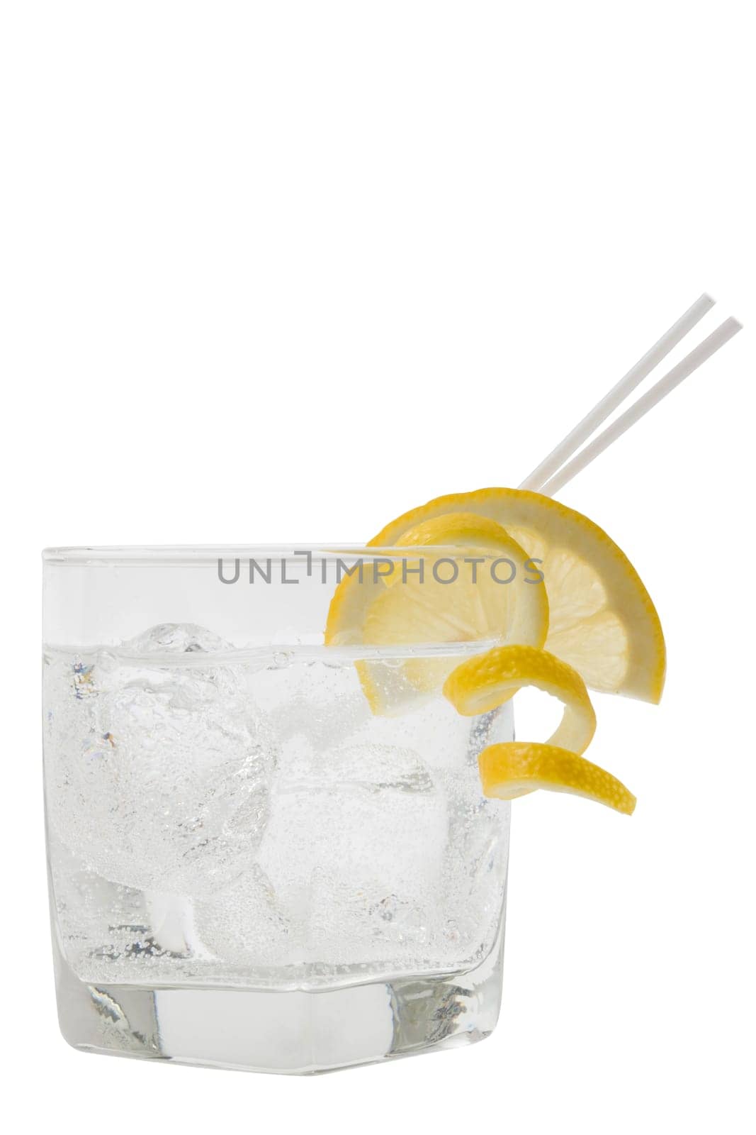 Club soda with lemon slice and peel garnish on white background