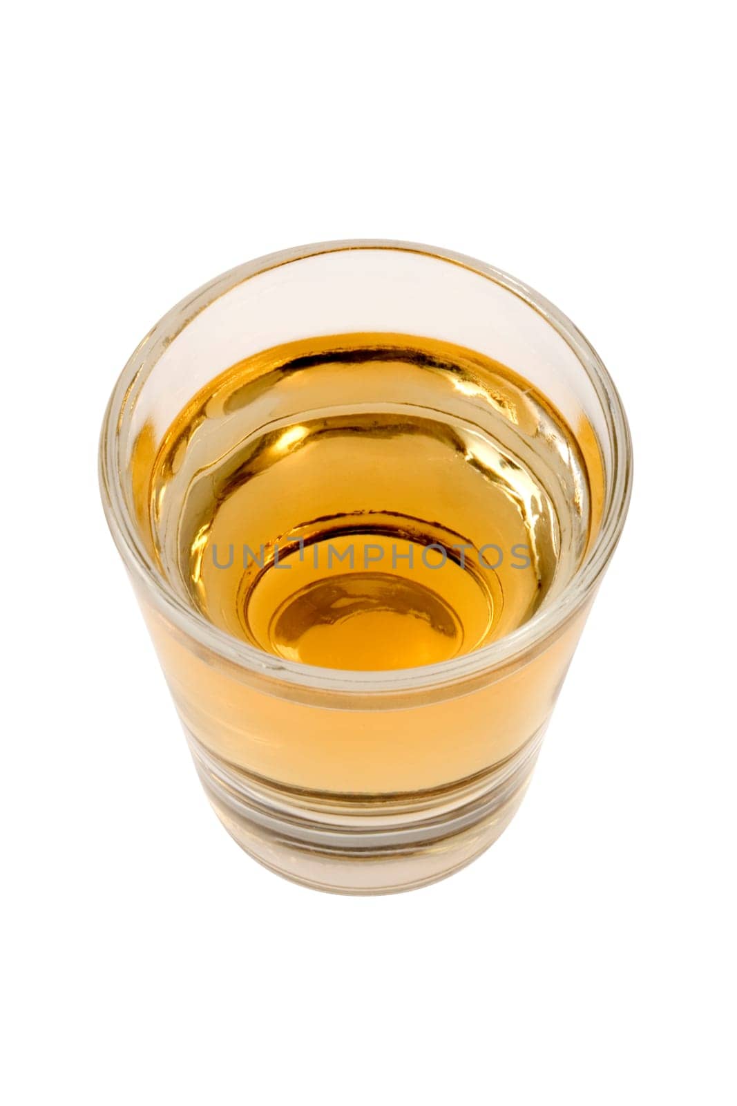 Whiskey neat in shot glass on white background
