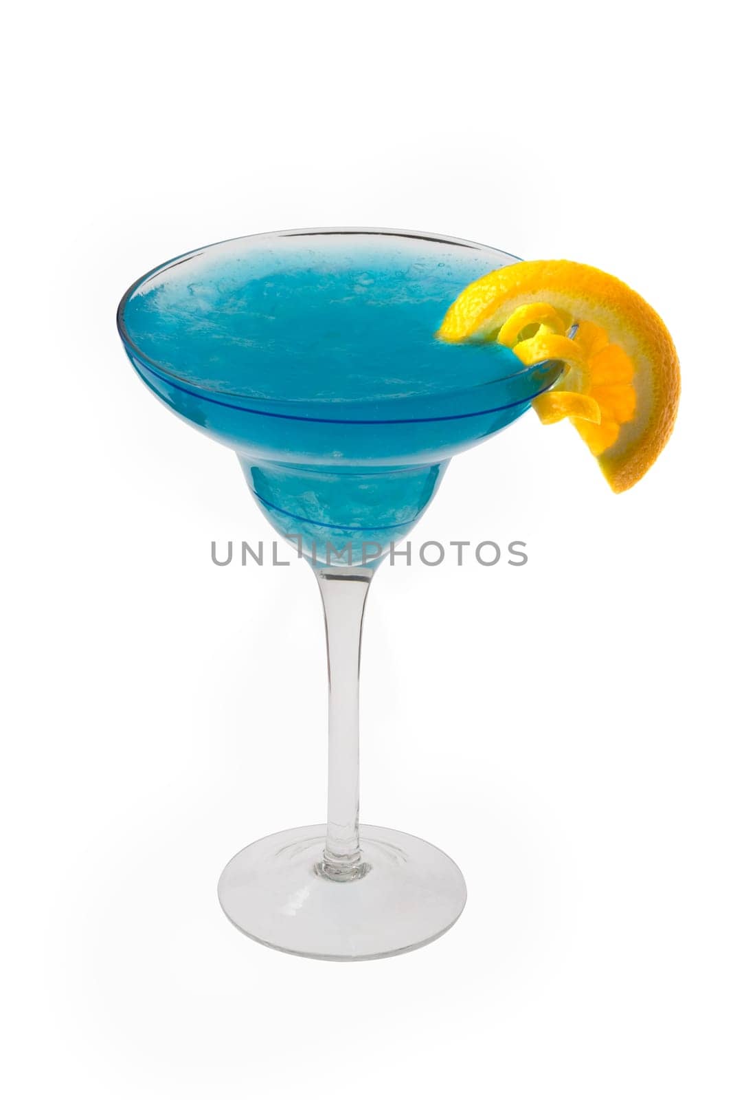 Blue Hawaiian mixed drink with orange and lemon garnish on white background