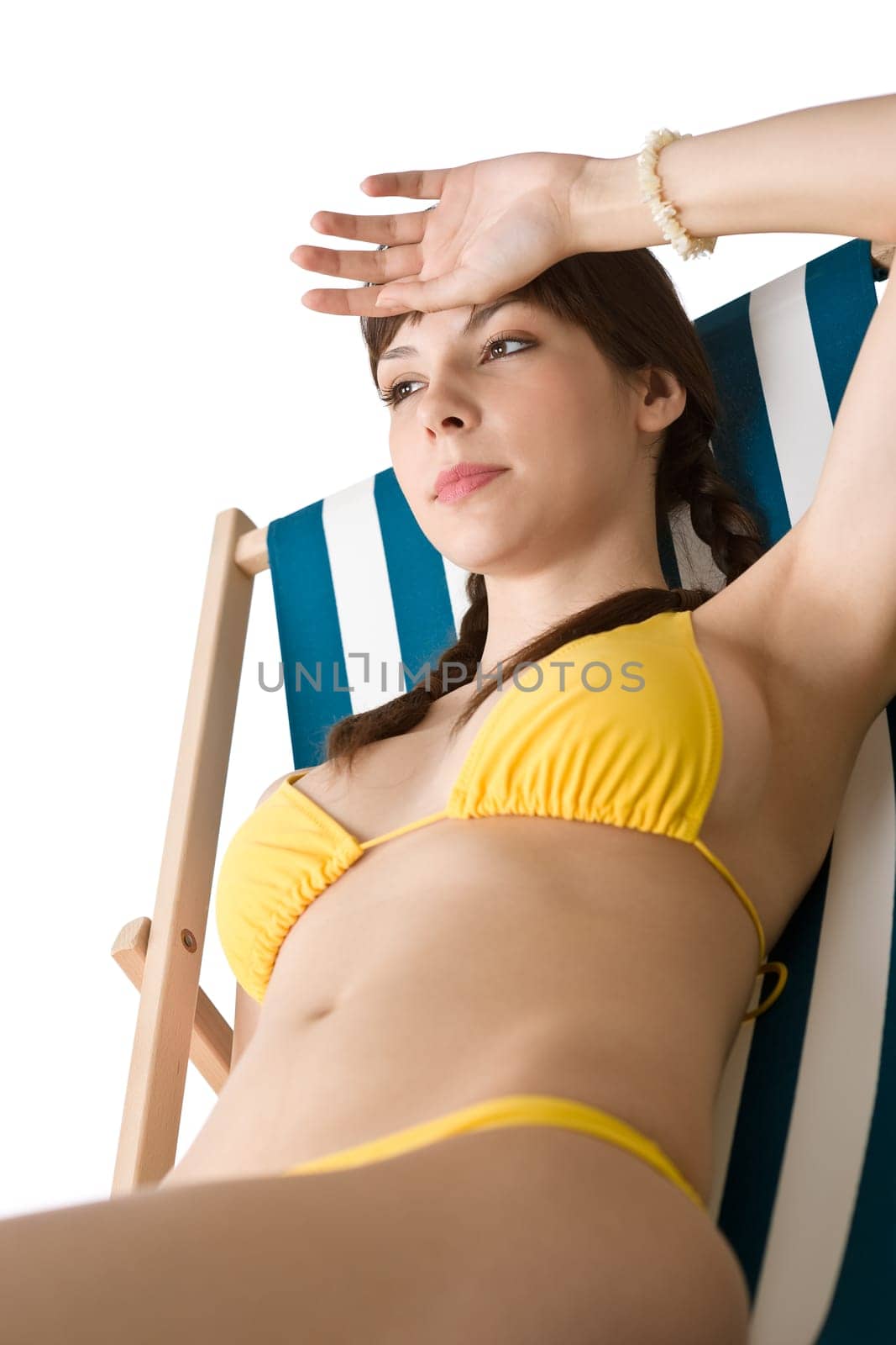 Beach - Woman in bikini sunbathing on deck chair