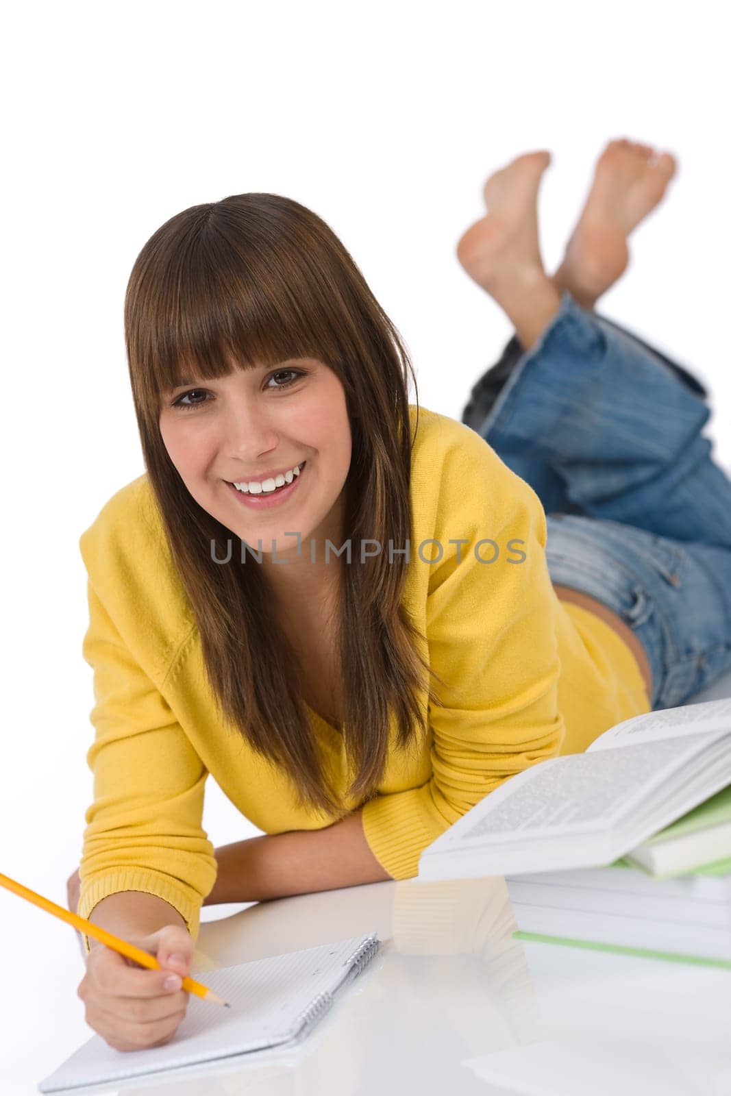 Student - Happy female teenager write homework think