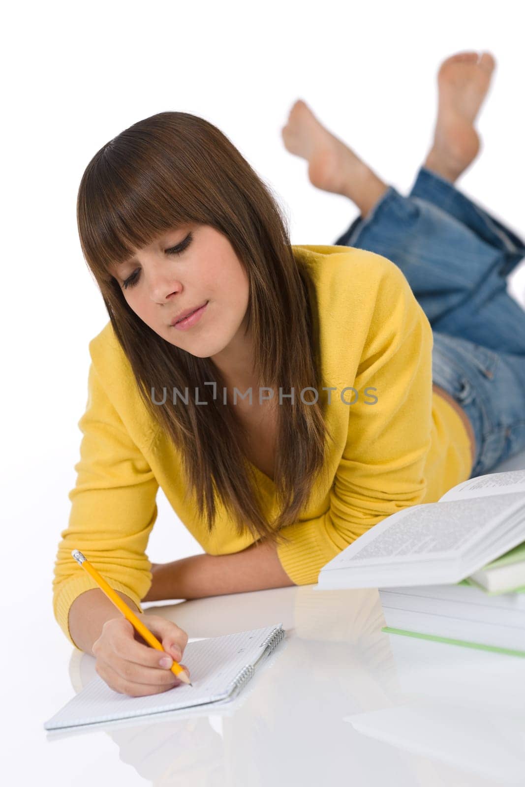 Student - Happy female teenager write homework think