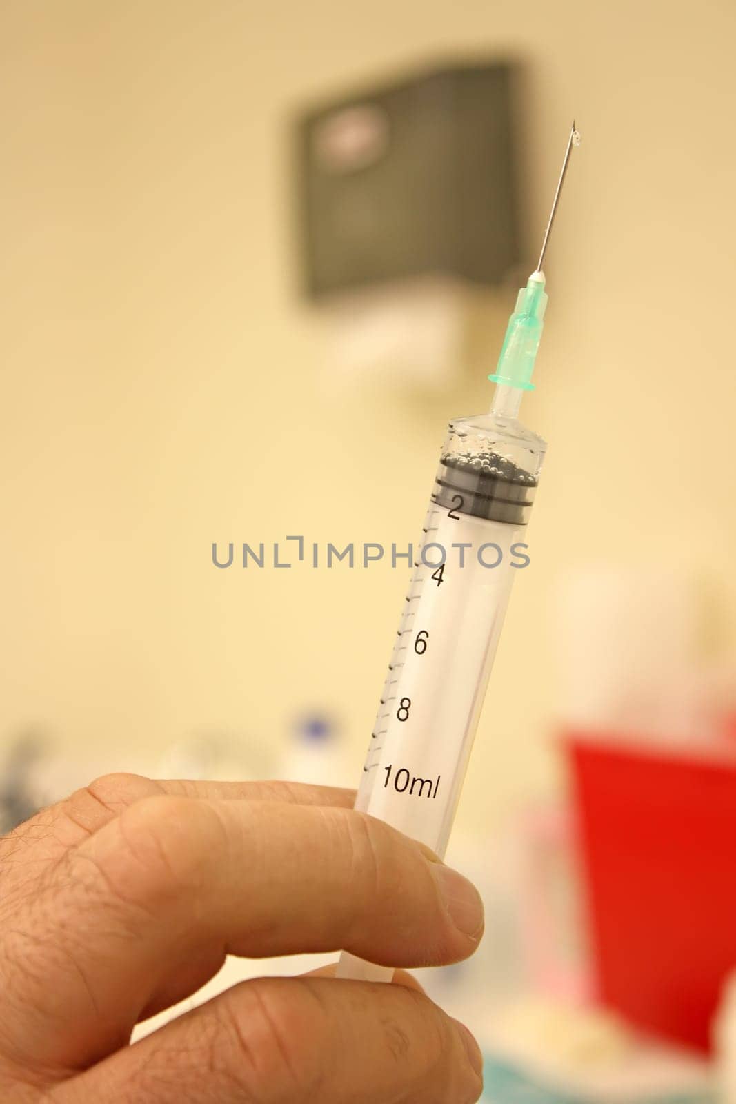 Doctor with a syringe in his hand