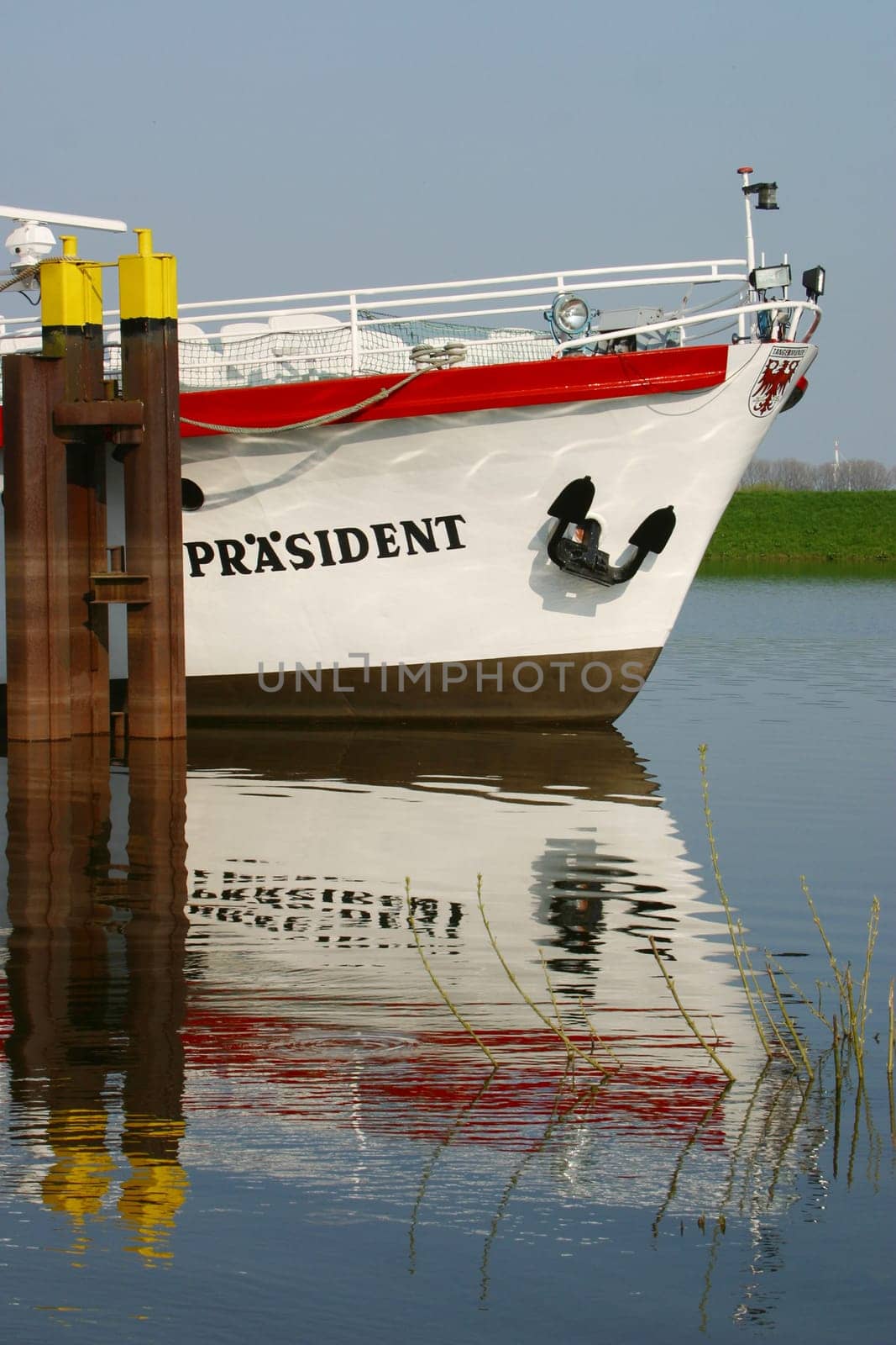 Excursion boat reflected in the water