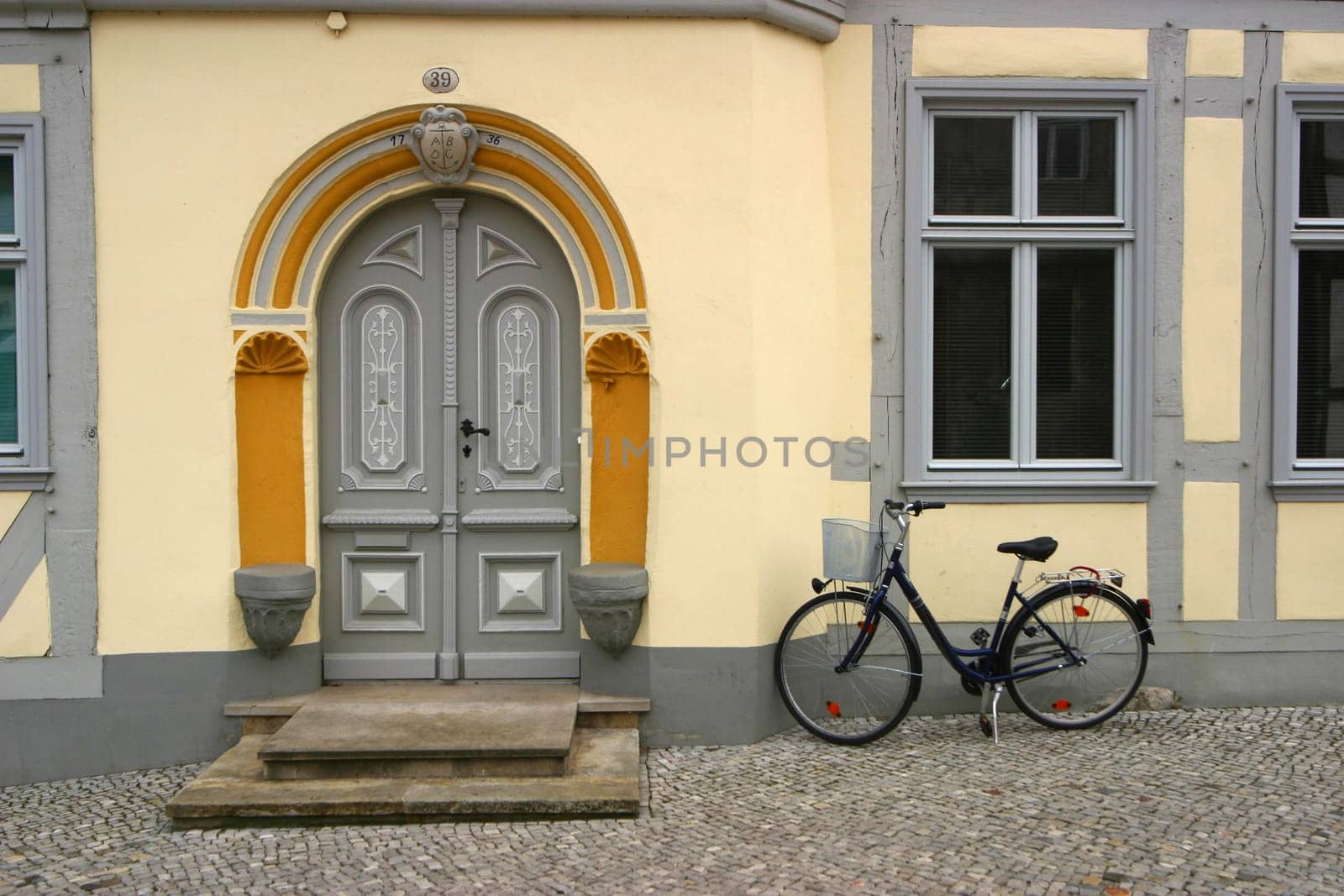 Bicycle in front of restored house