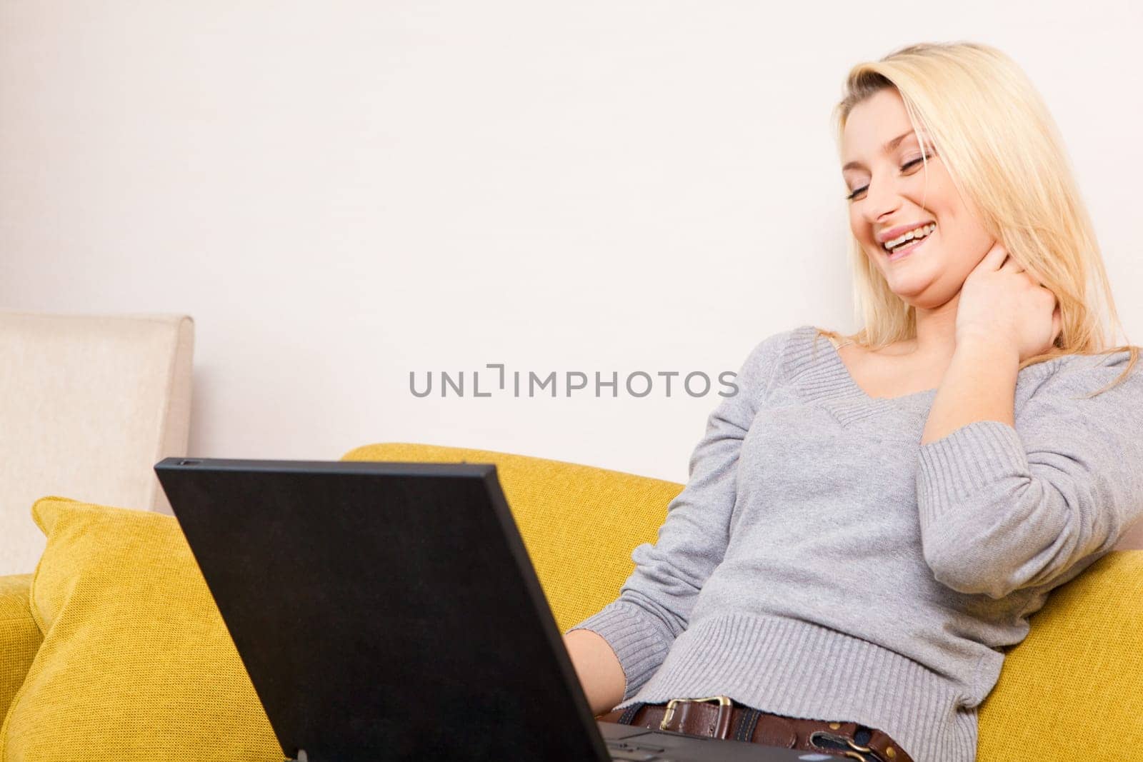woman sitting on sofa and having coffee