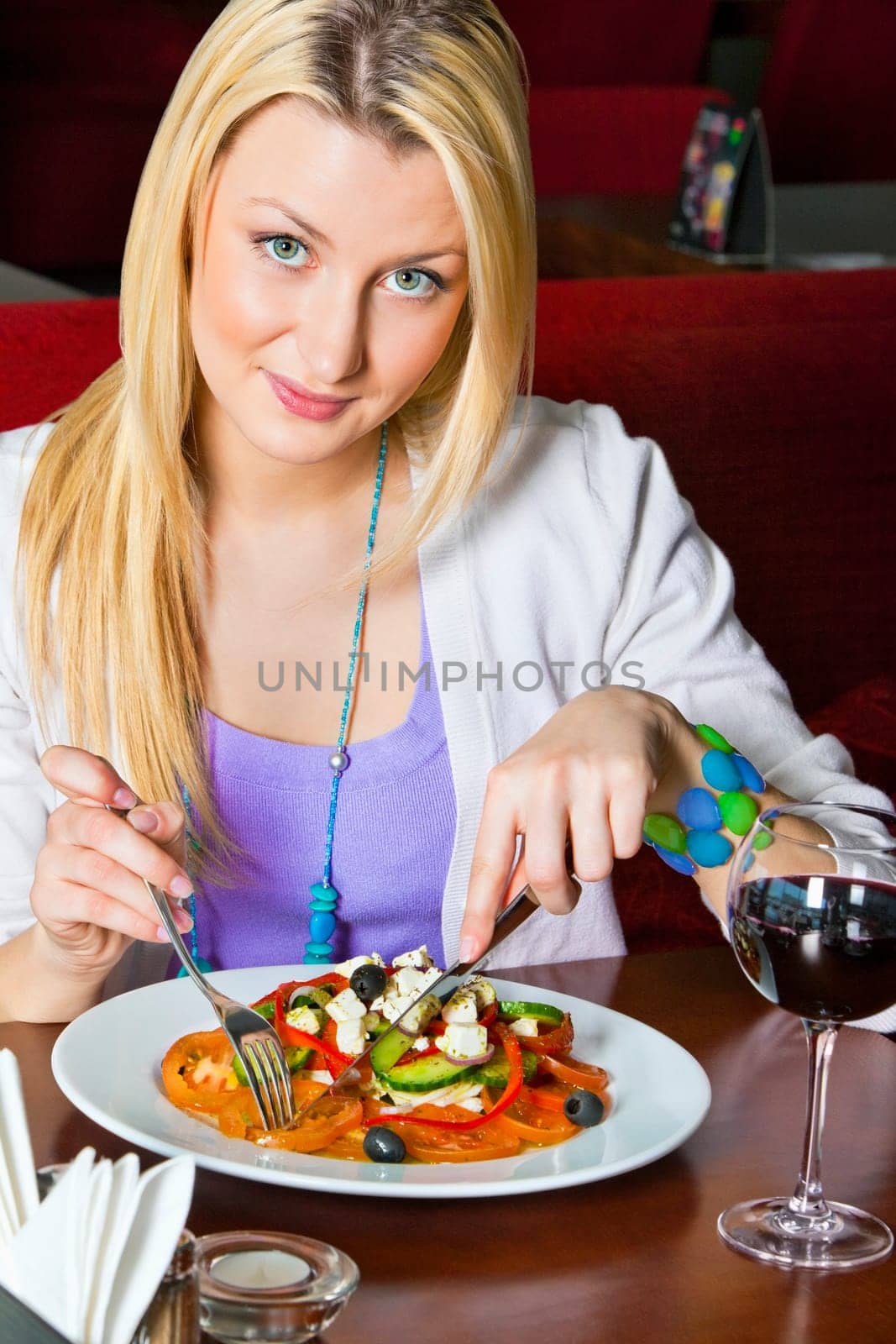 woman sitting on sofa and having coffee