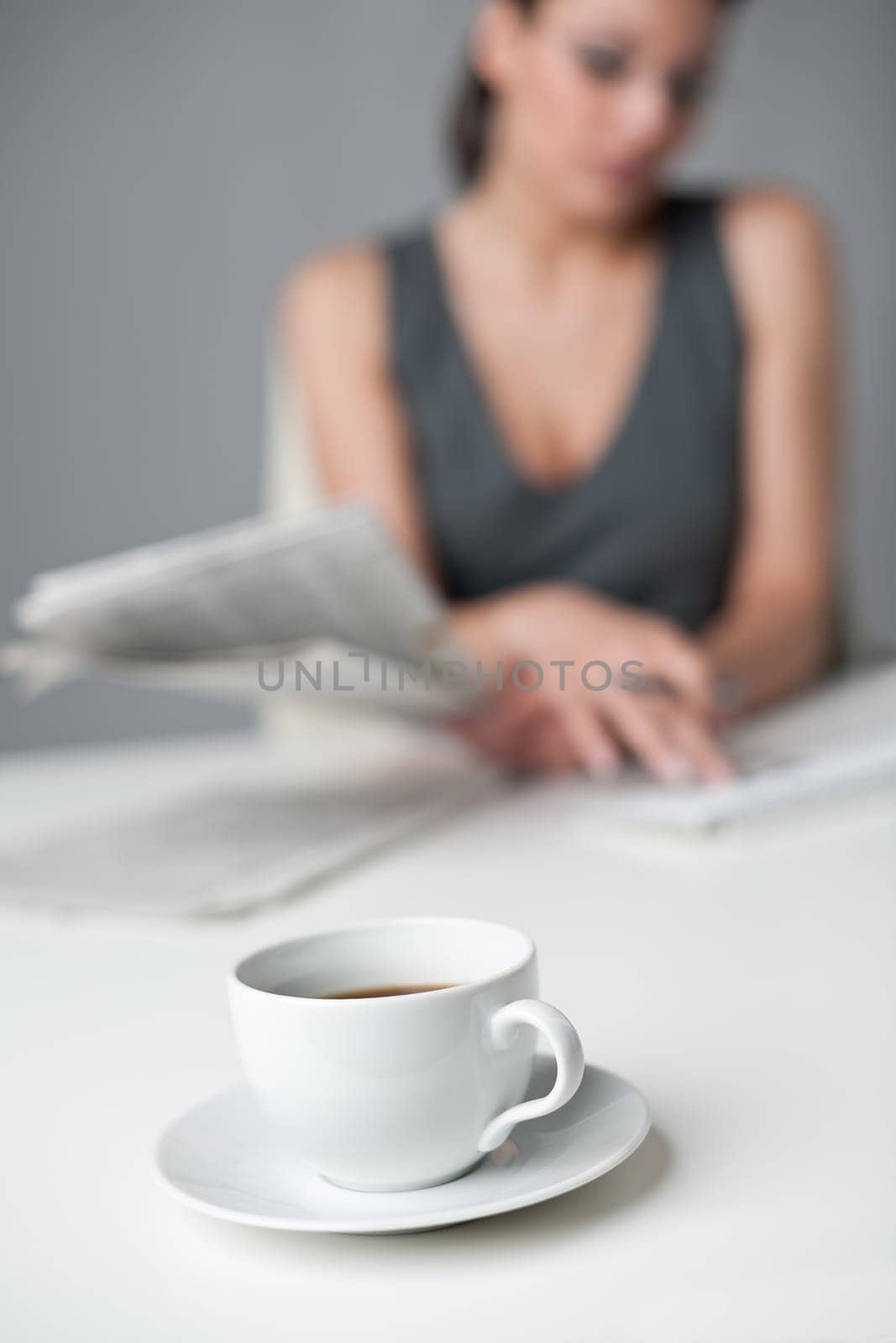 Successful businesswoman read newspaper at office