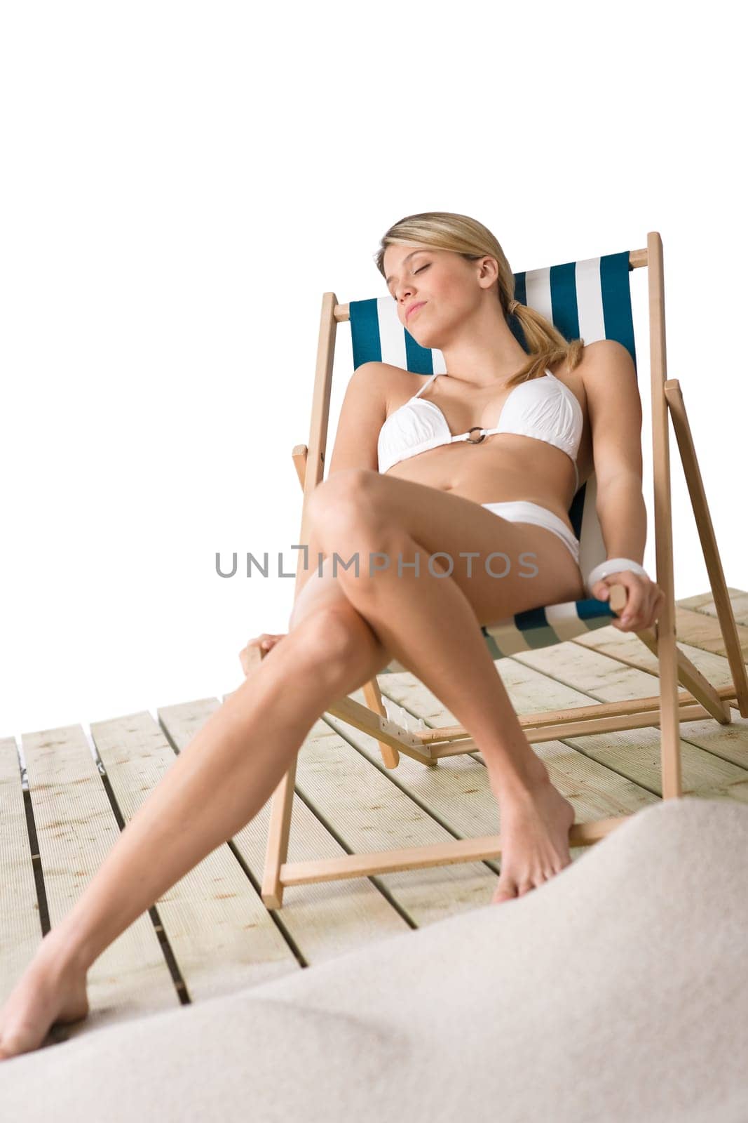 Beach - Woman in bikini sunbathing on deck chair