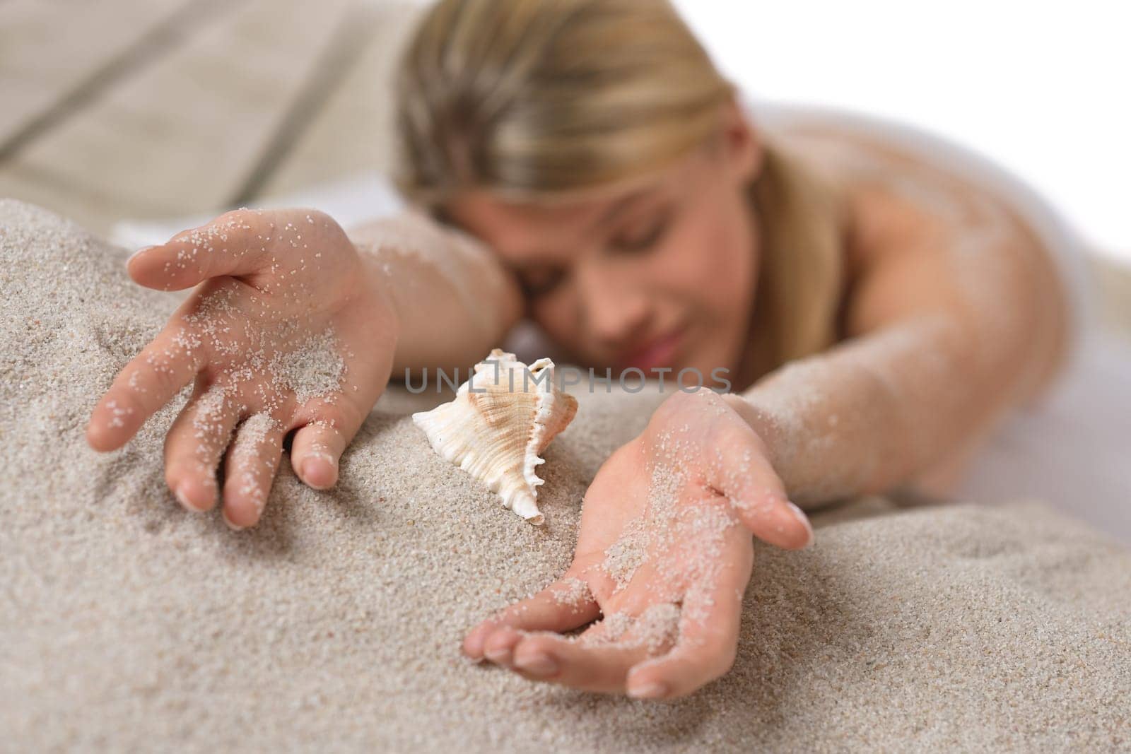 Beach - woman with shell on sand