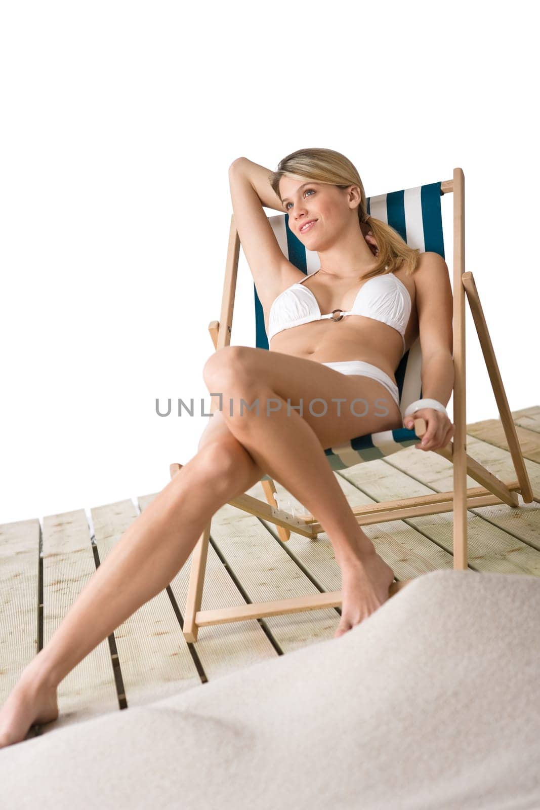 Beach - Woman in bikini sunbathing on deck chair
