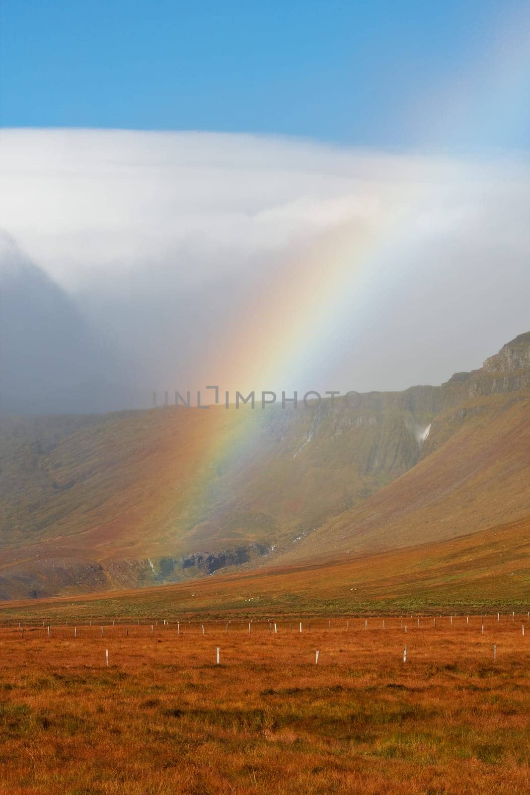 Beautiful rainbow over the mountains, North Fjords Iceland