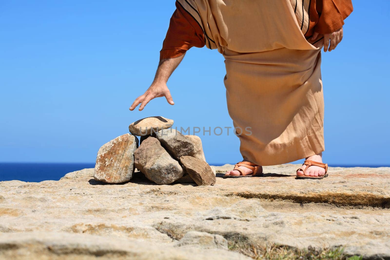 Man by stones  concept Sin Punishment