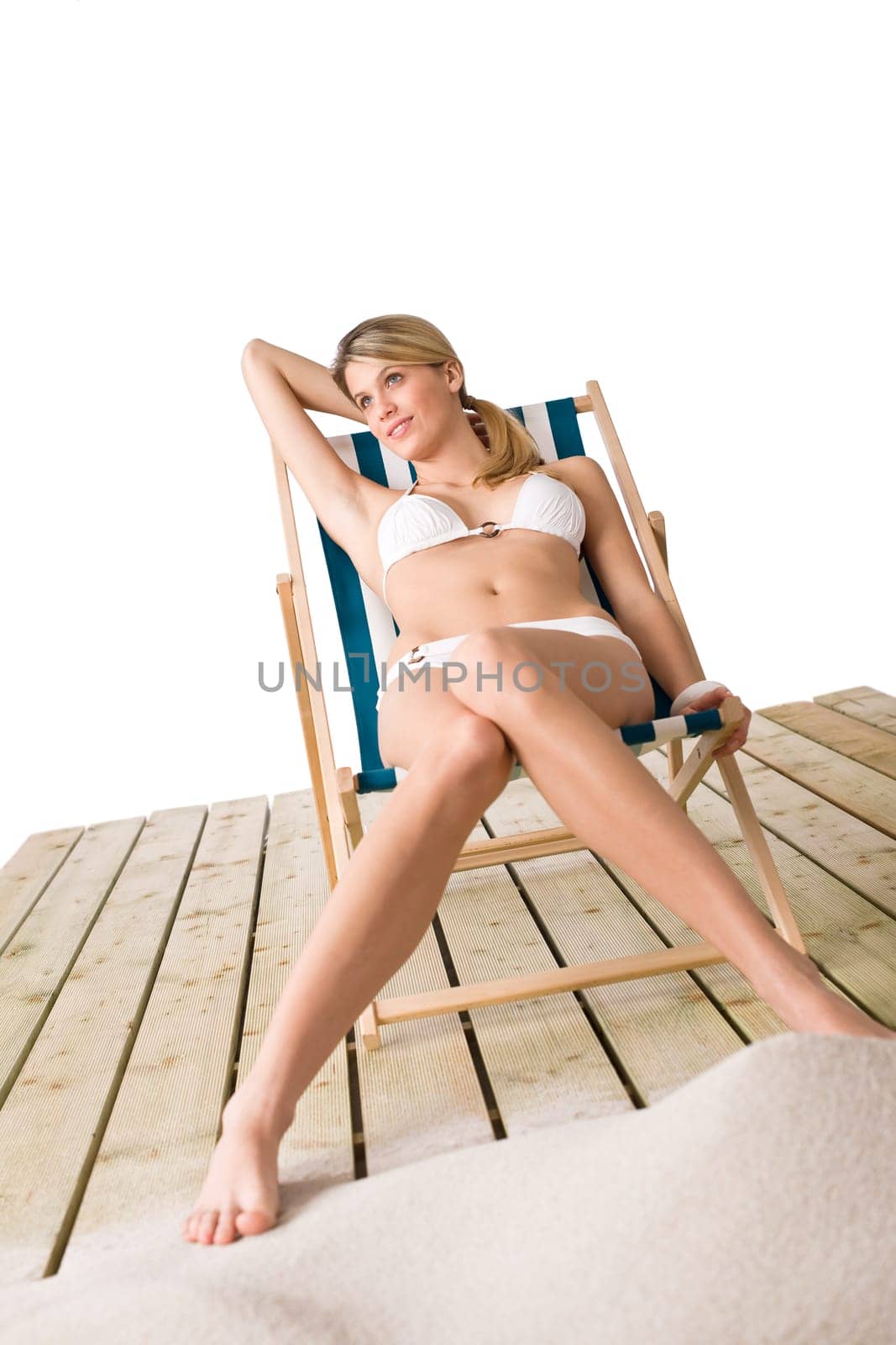 Beach - Woman in bikini sunbathing on deck chair