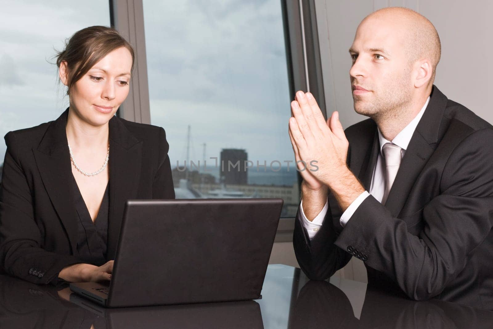 Businessman with assistant laughing