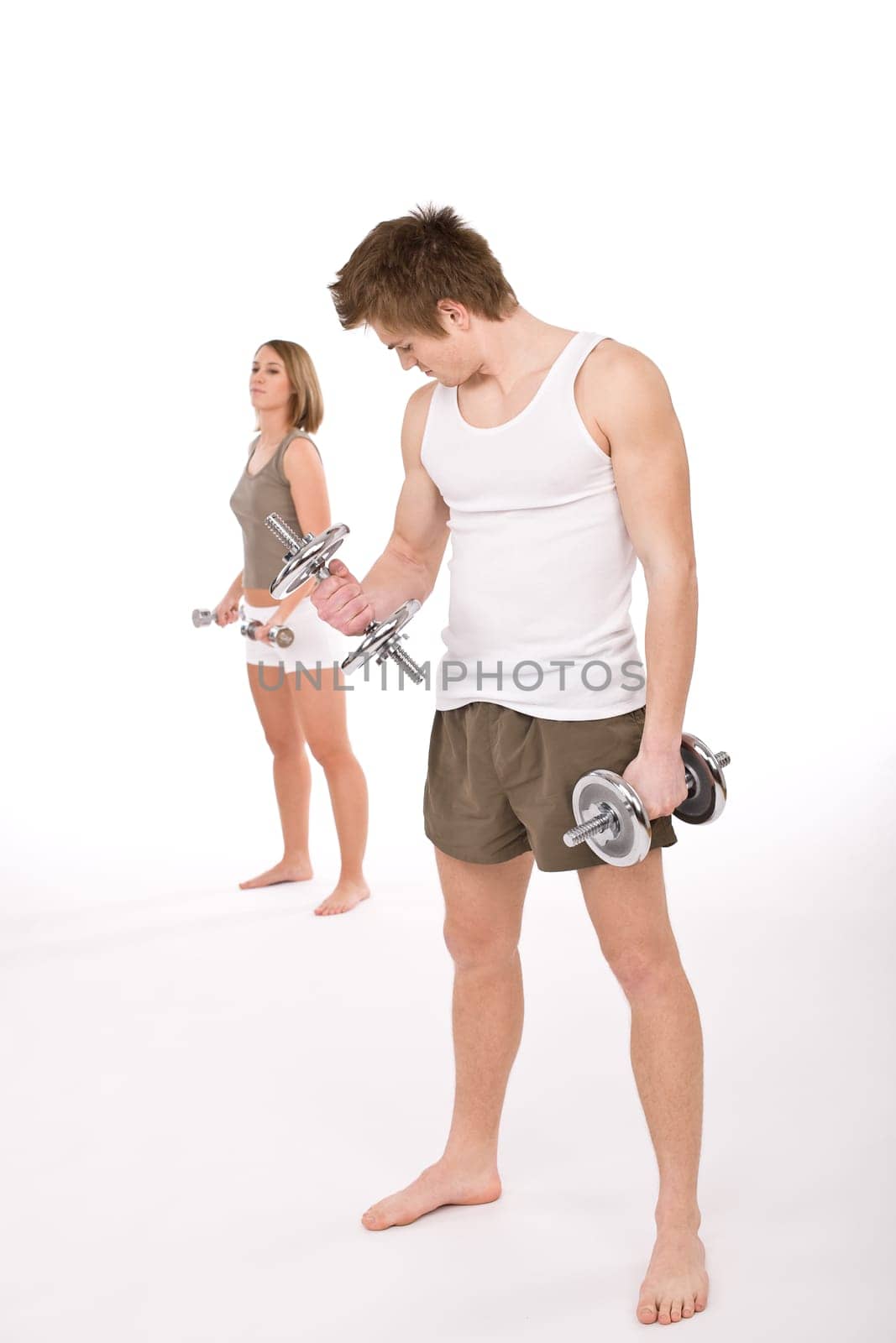 Fitness - happy couple with weights