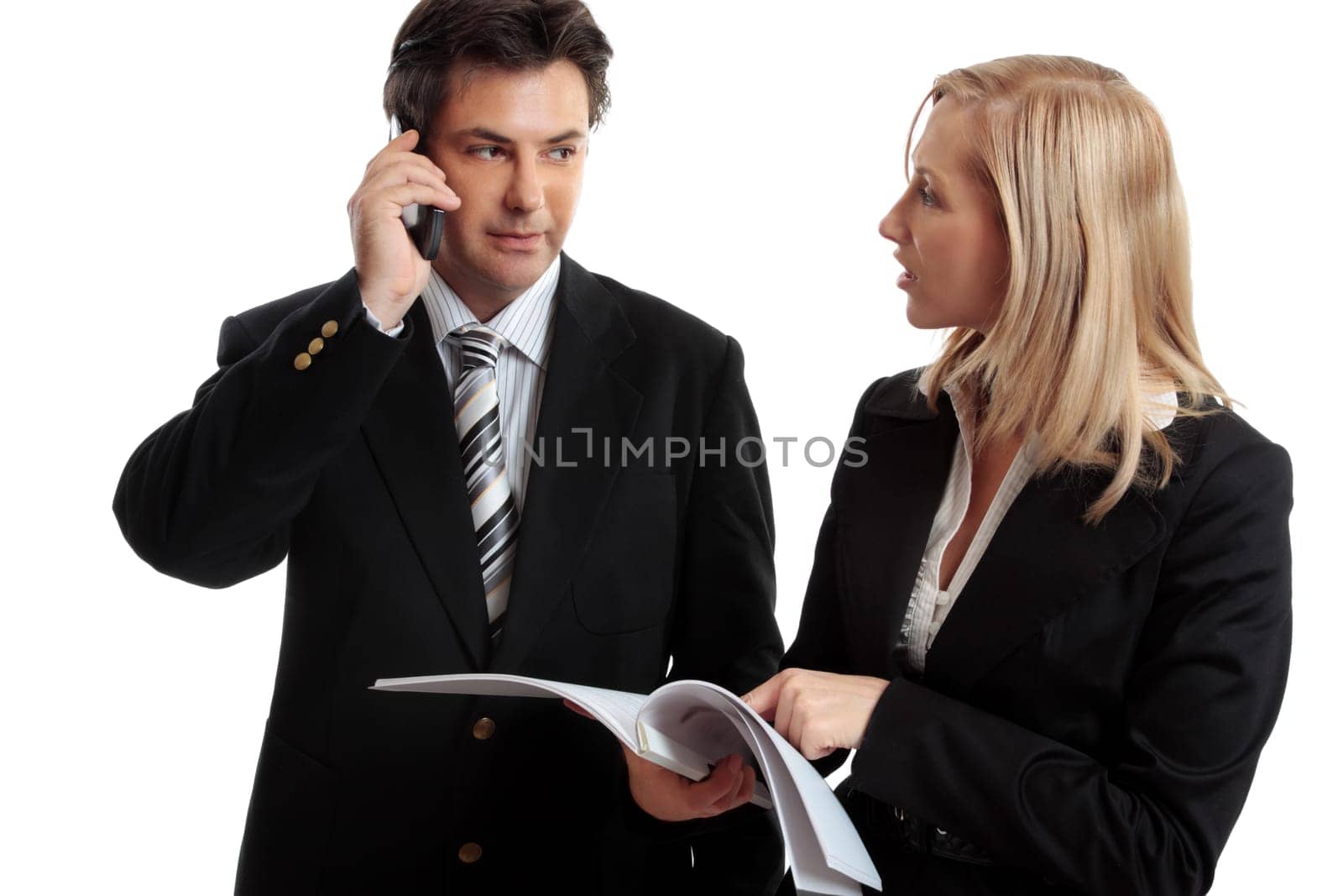 Business people discuss report