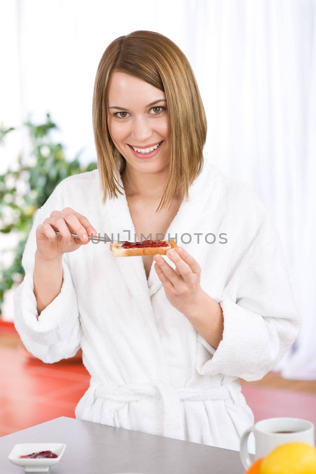 Breakfast - Happy woman with toast