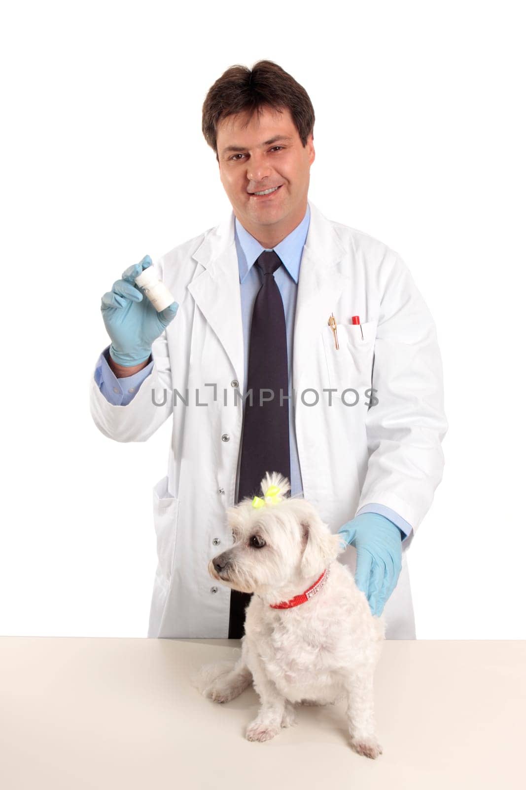 Vet with bottle of pills tablets