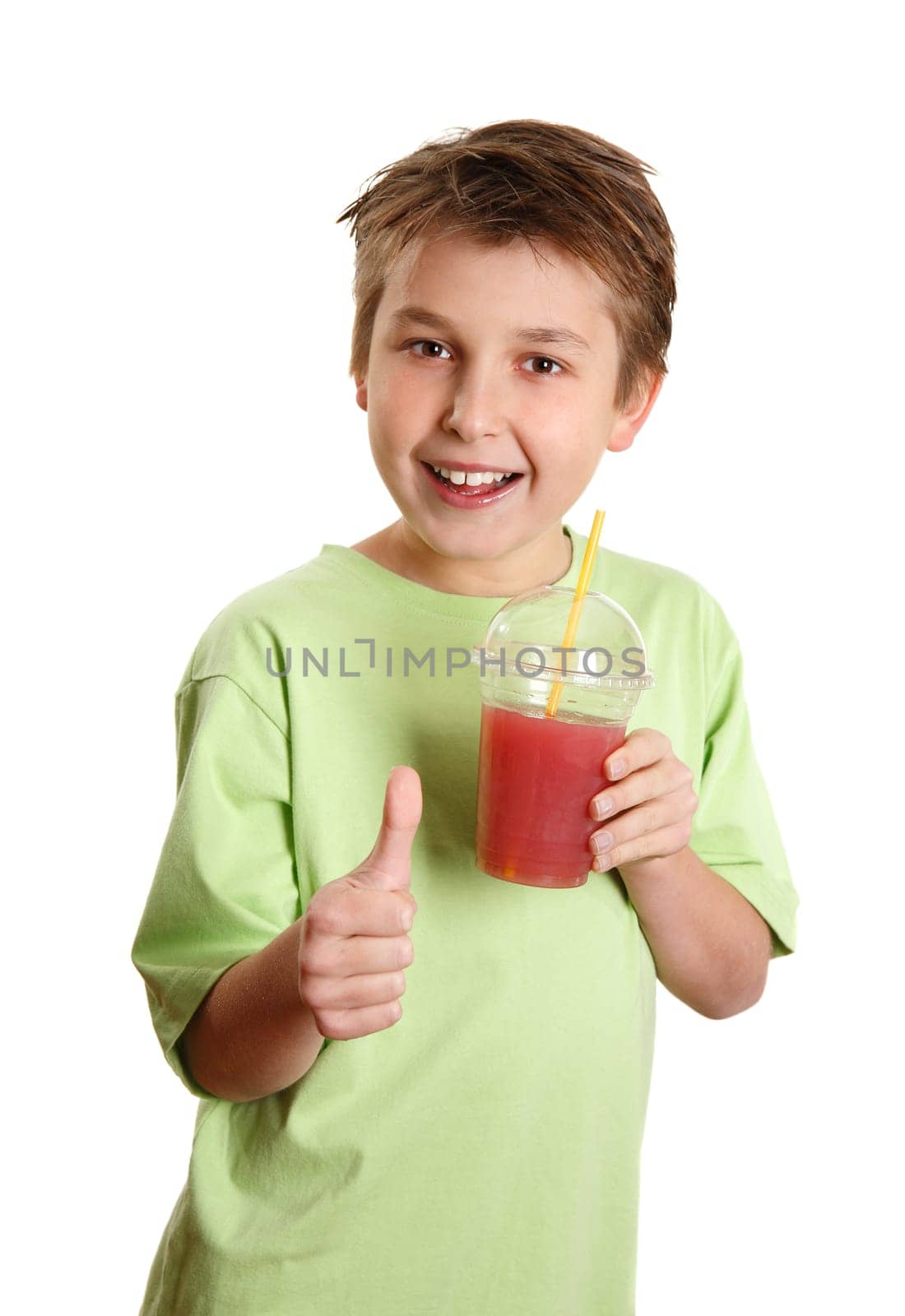 Healthy boy drinking juice thumbs up