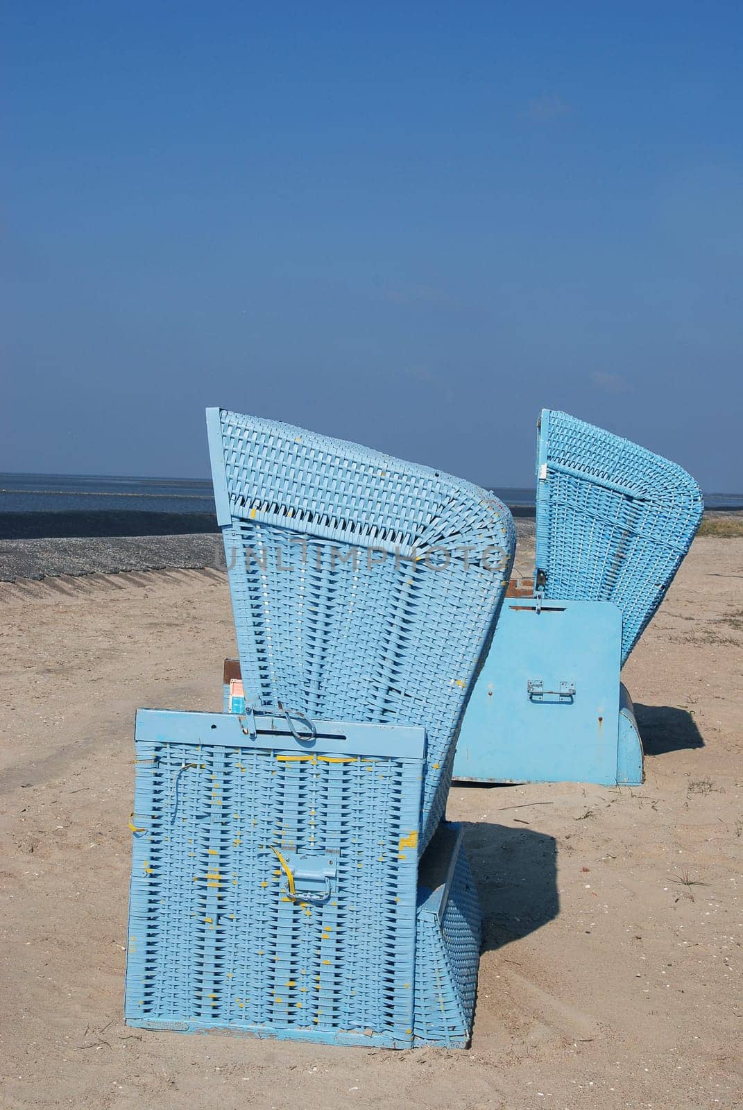 Two blue beach chairs