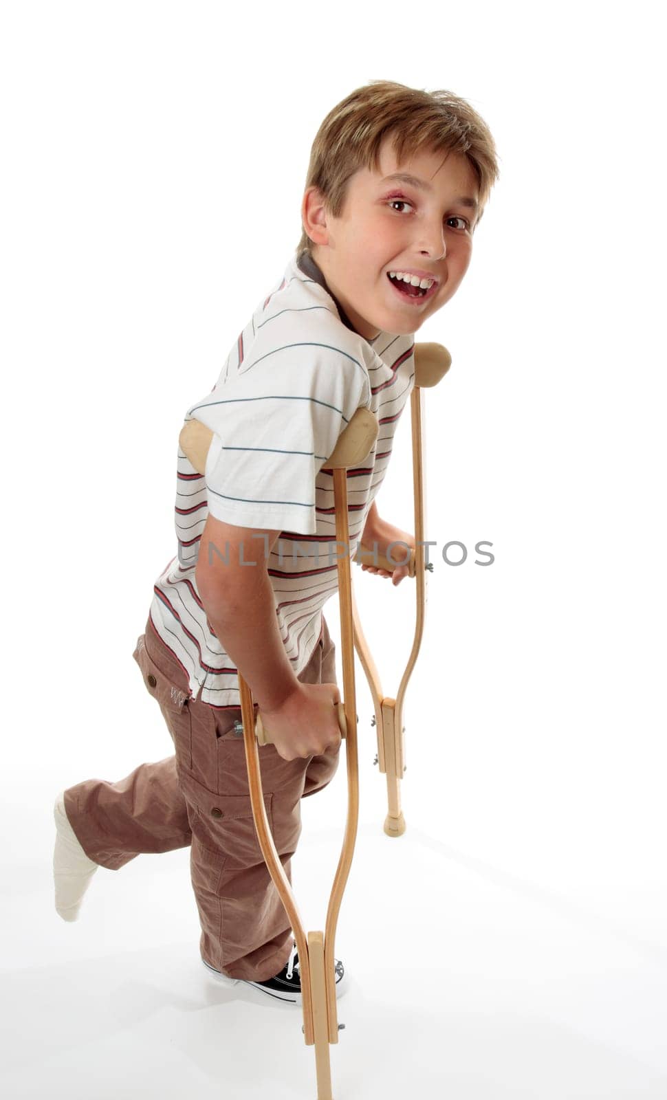 Smiling boy on crutches