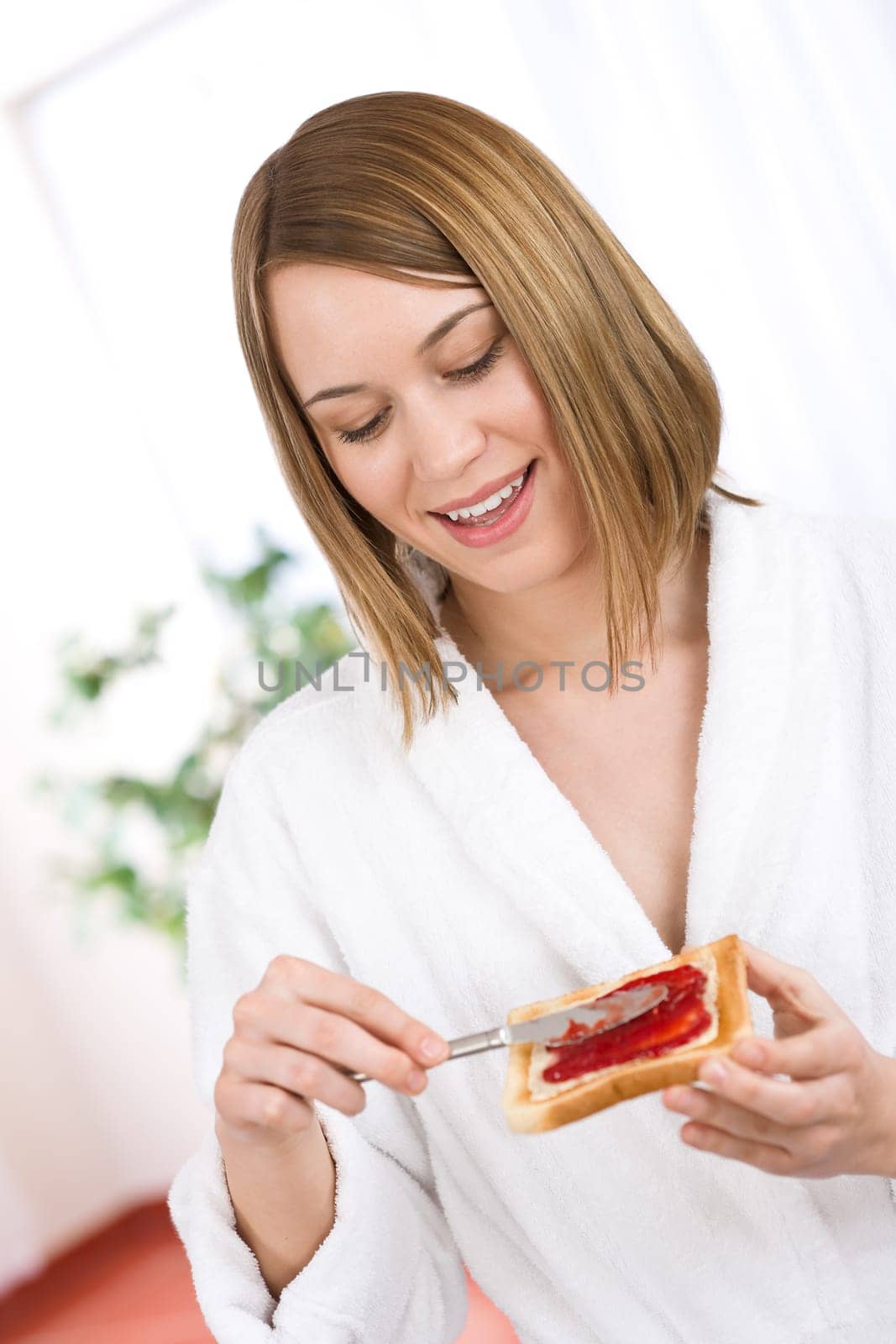 Breakfast - Happy woman with toast