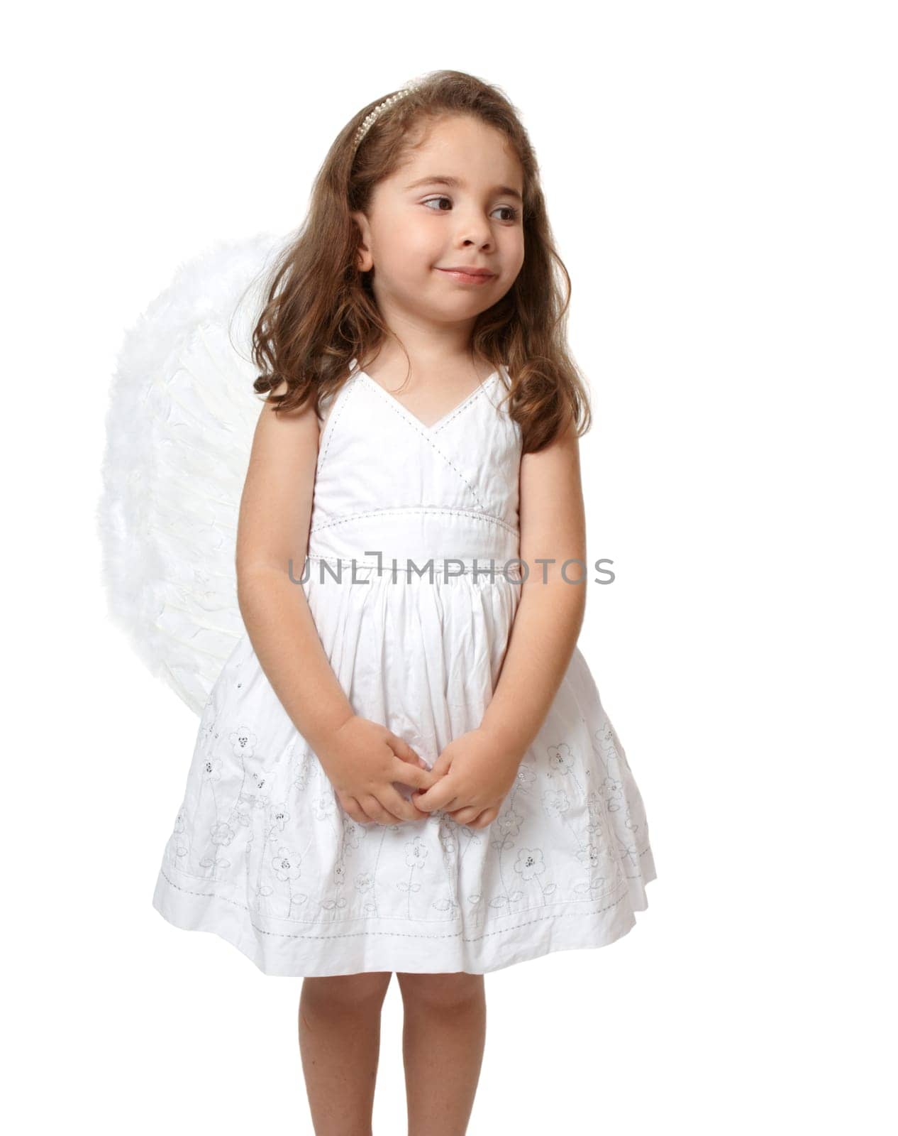 Little white angel looking sideways