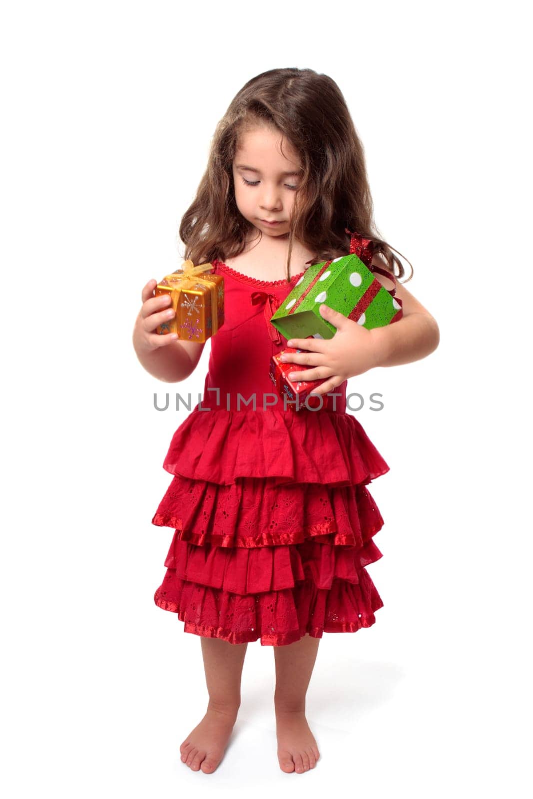 Little girl with armful of presents
