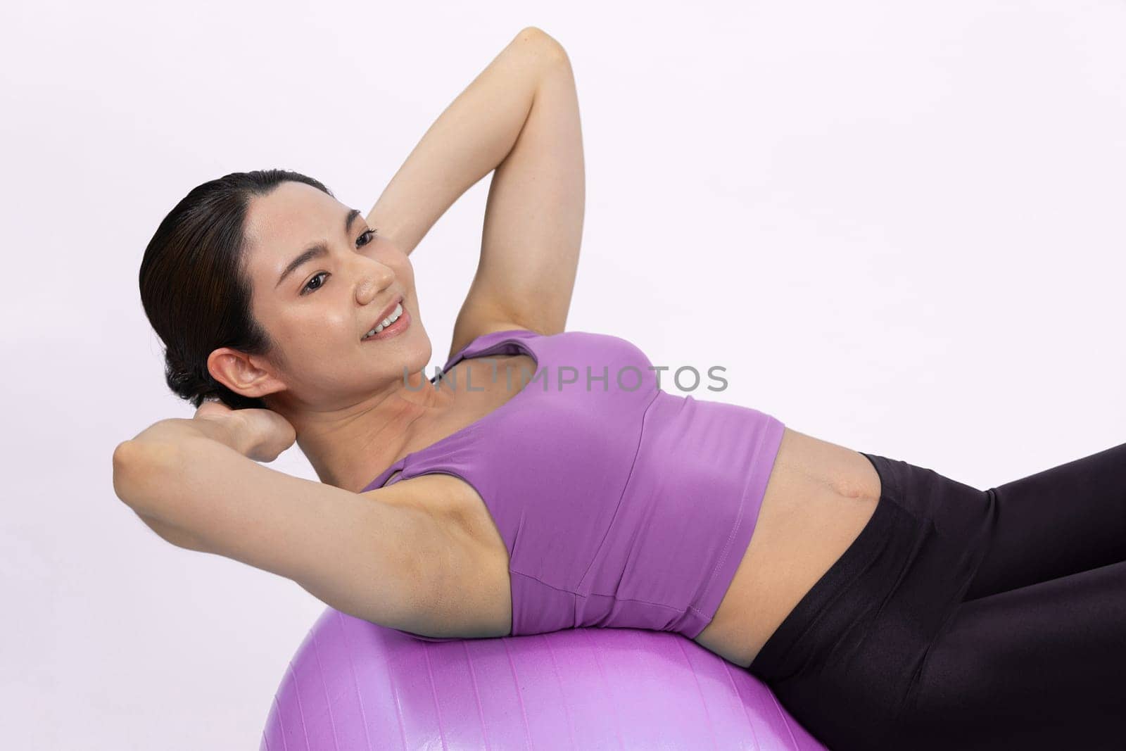 Young attractive asian woman portrait in sportswear with fit ball. Vigorous by biancoblue