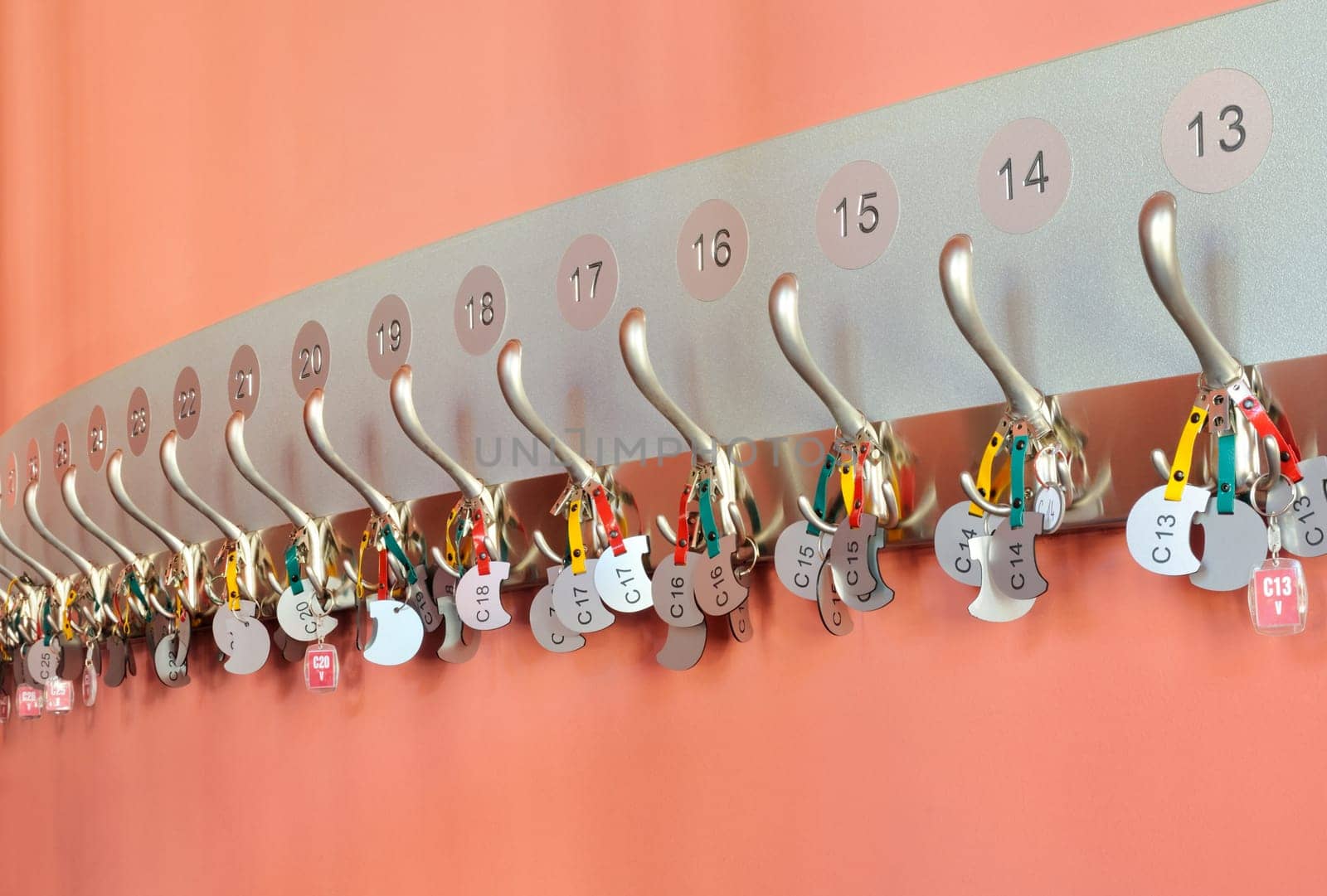 Coat hooks with labels organized in row
