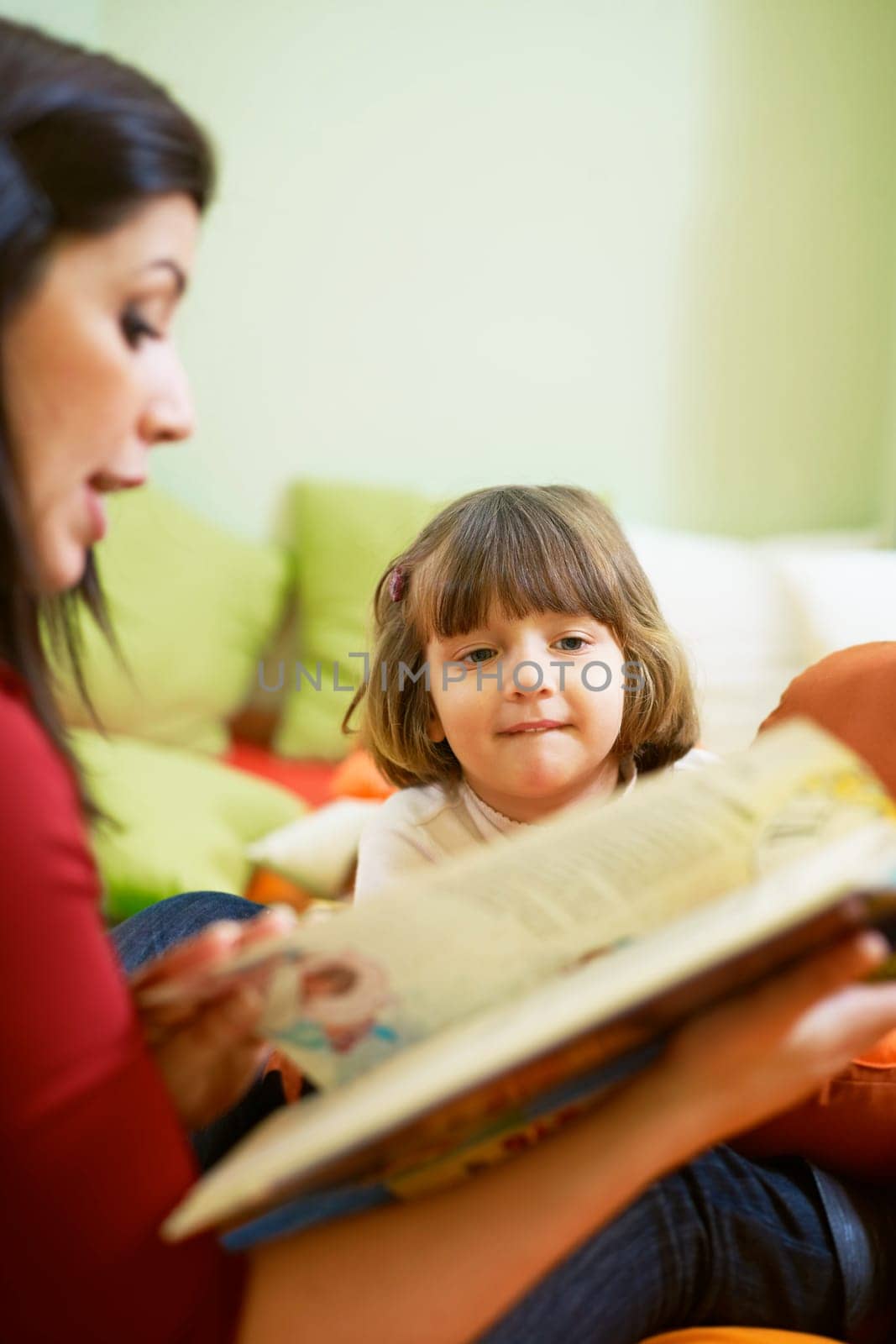 three little girls and female teacher in kindergarten