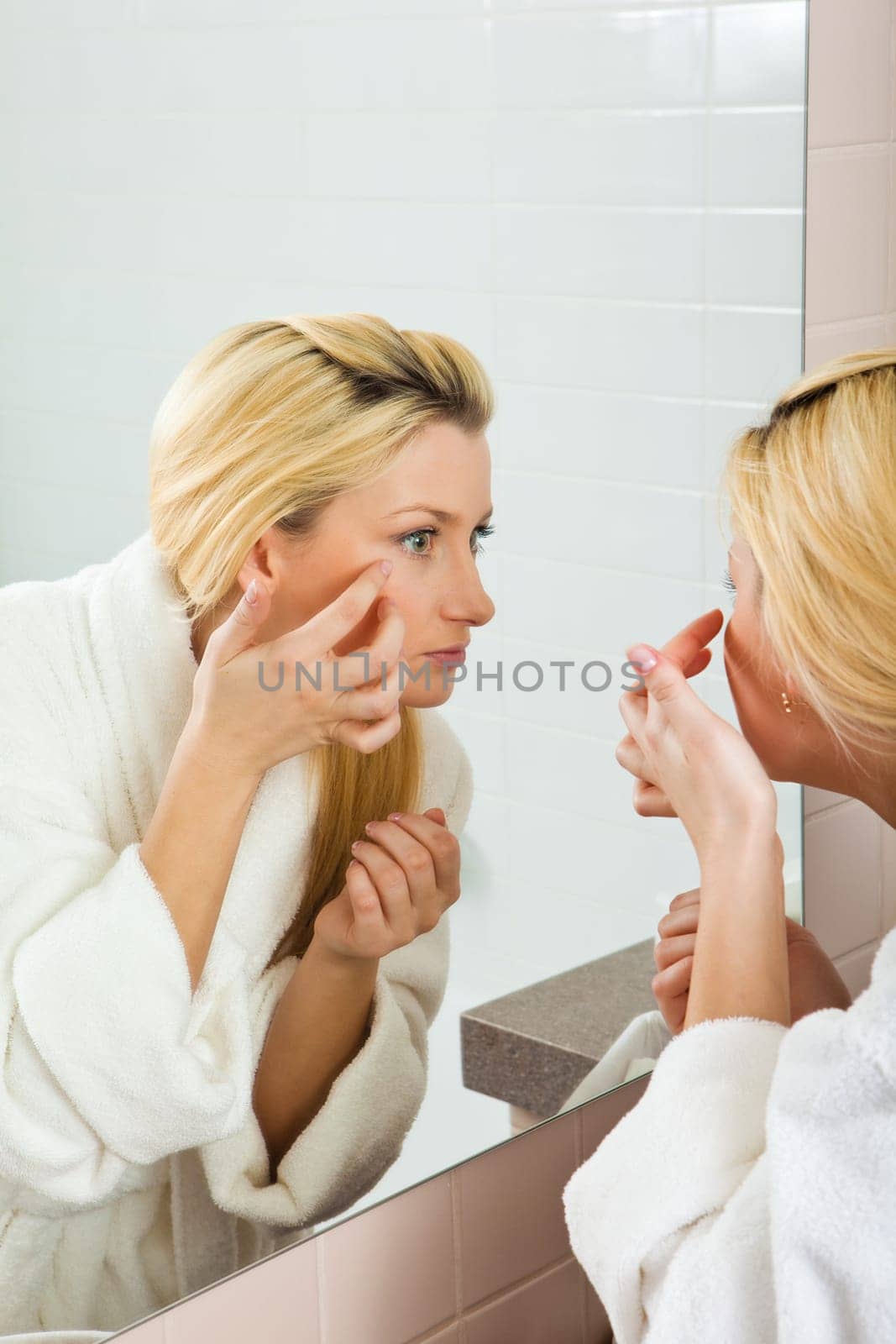 woman looking at computer and laughing