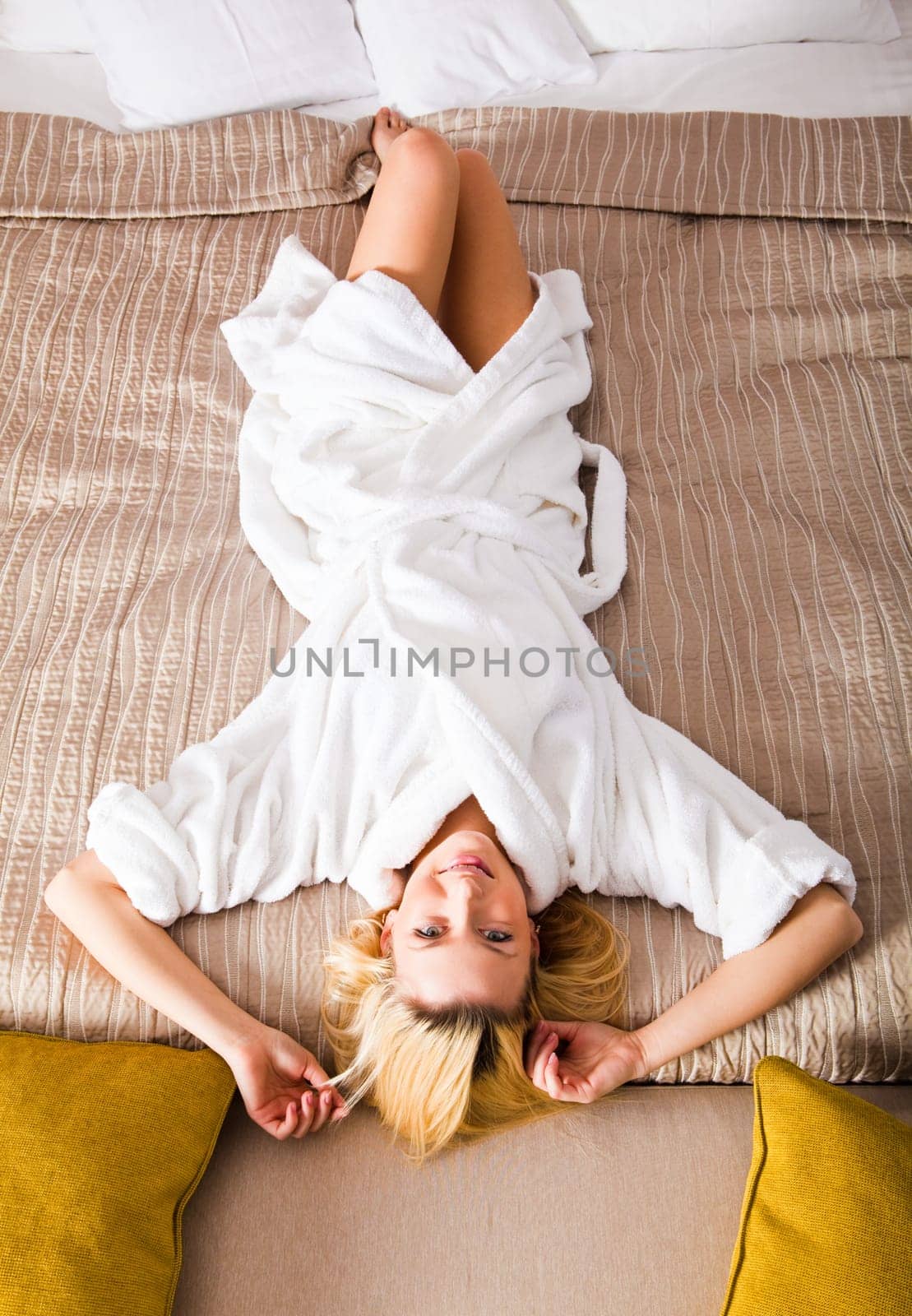 Woman Lying on Bed watching TV
