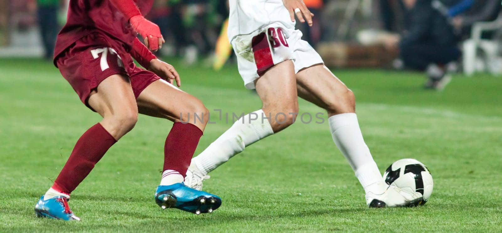 Soccer players fighting for the ball