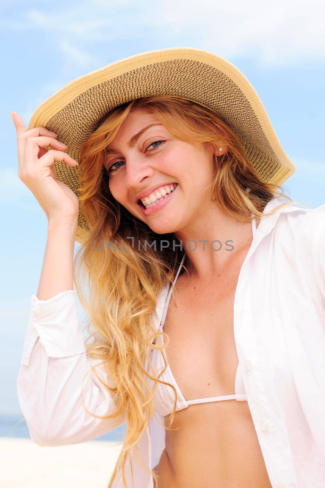Summer on the beach Woman with straw hat