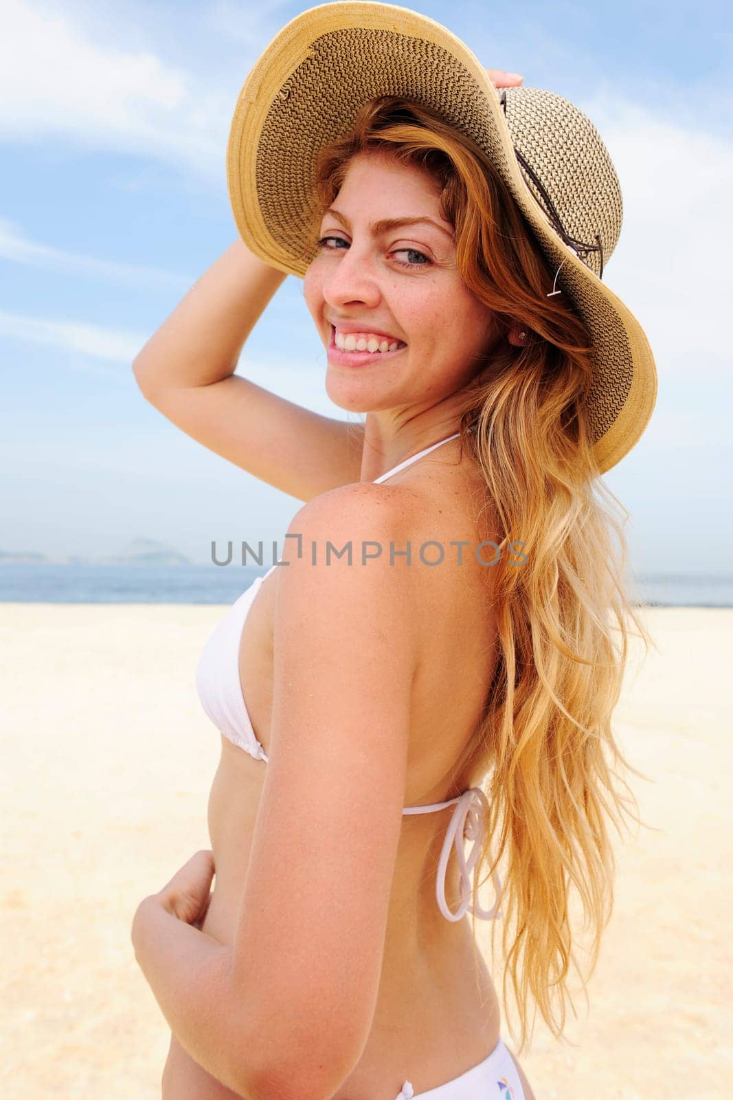 Summer on the beach Woman with straw hat