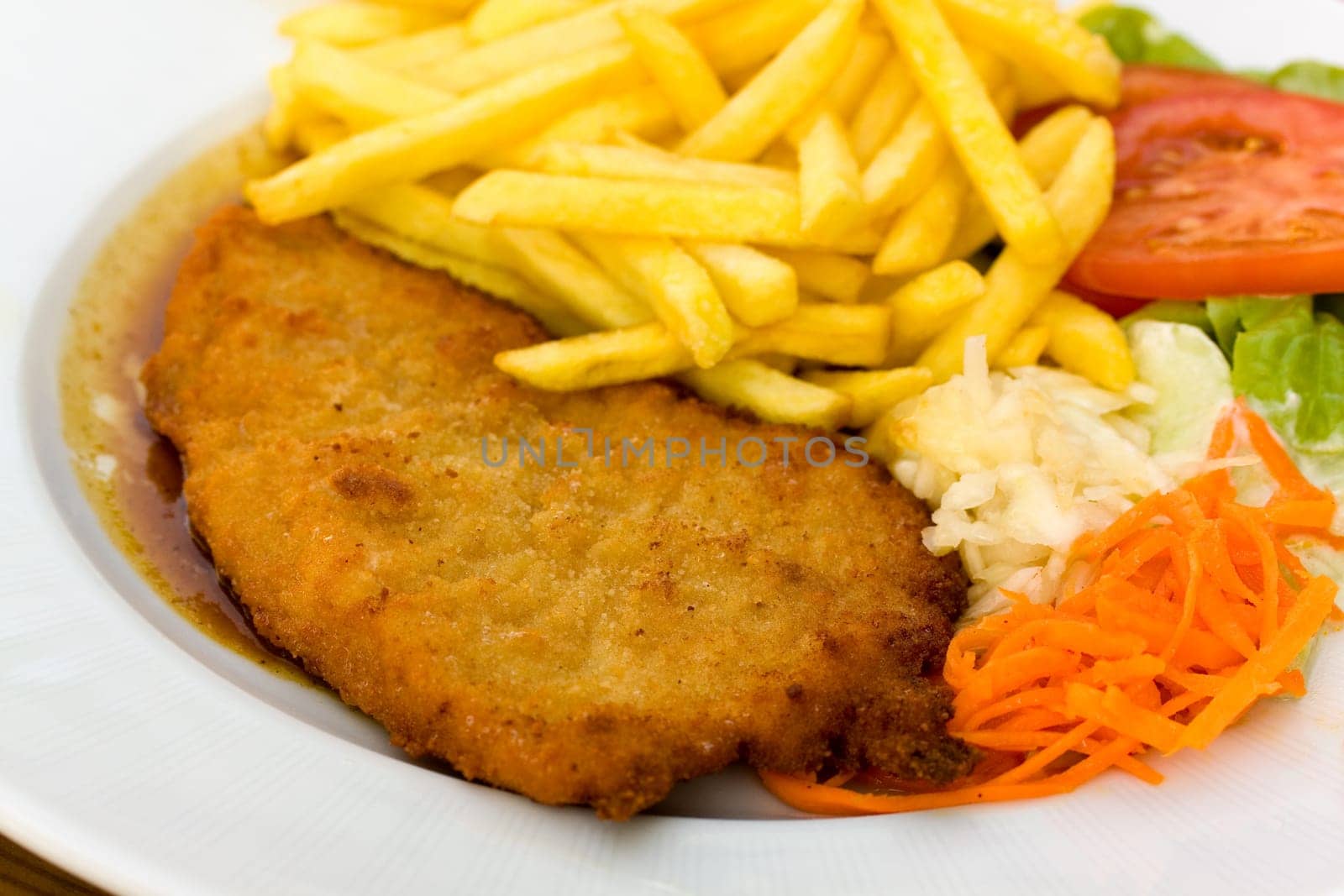 Breaded schnitzel with french fries