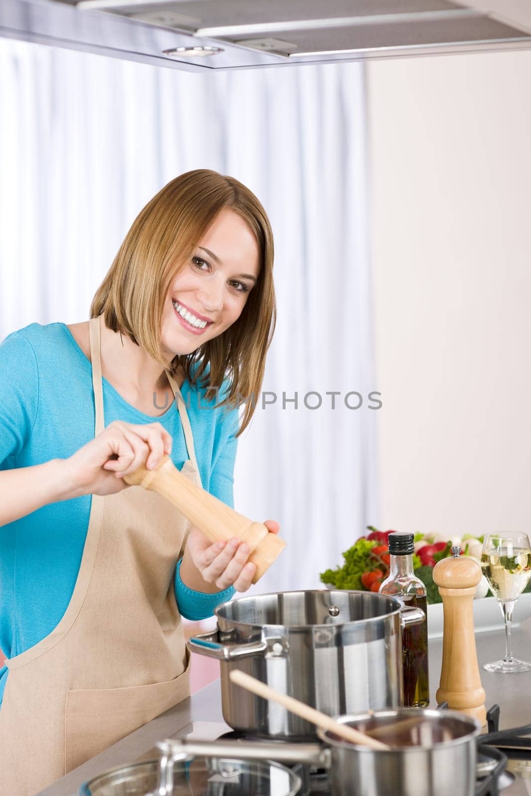 Cooking - Young woman in kitchen