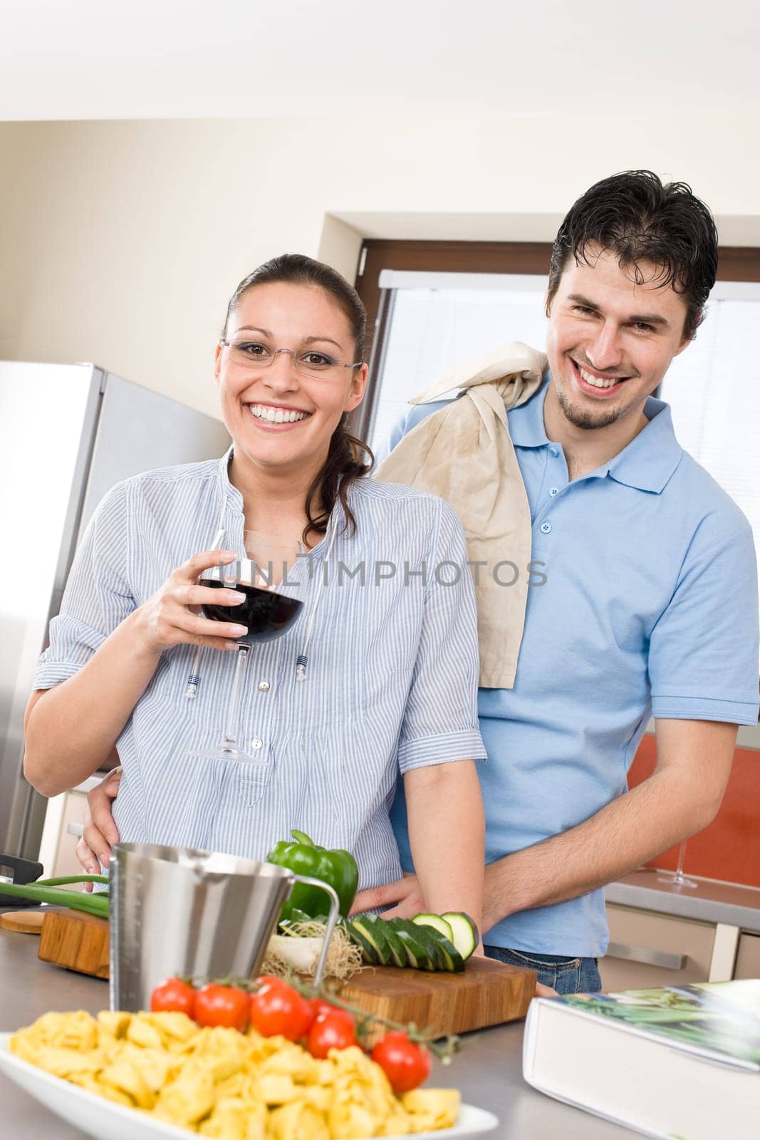 Cheerful couple in modern kitchen