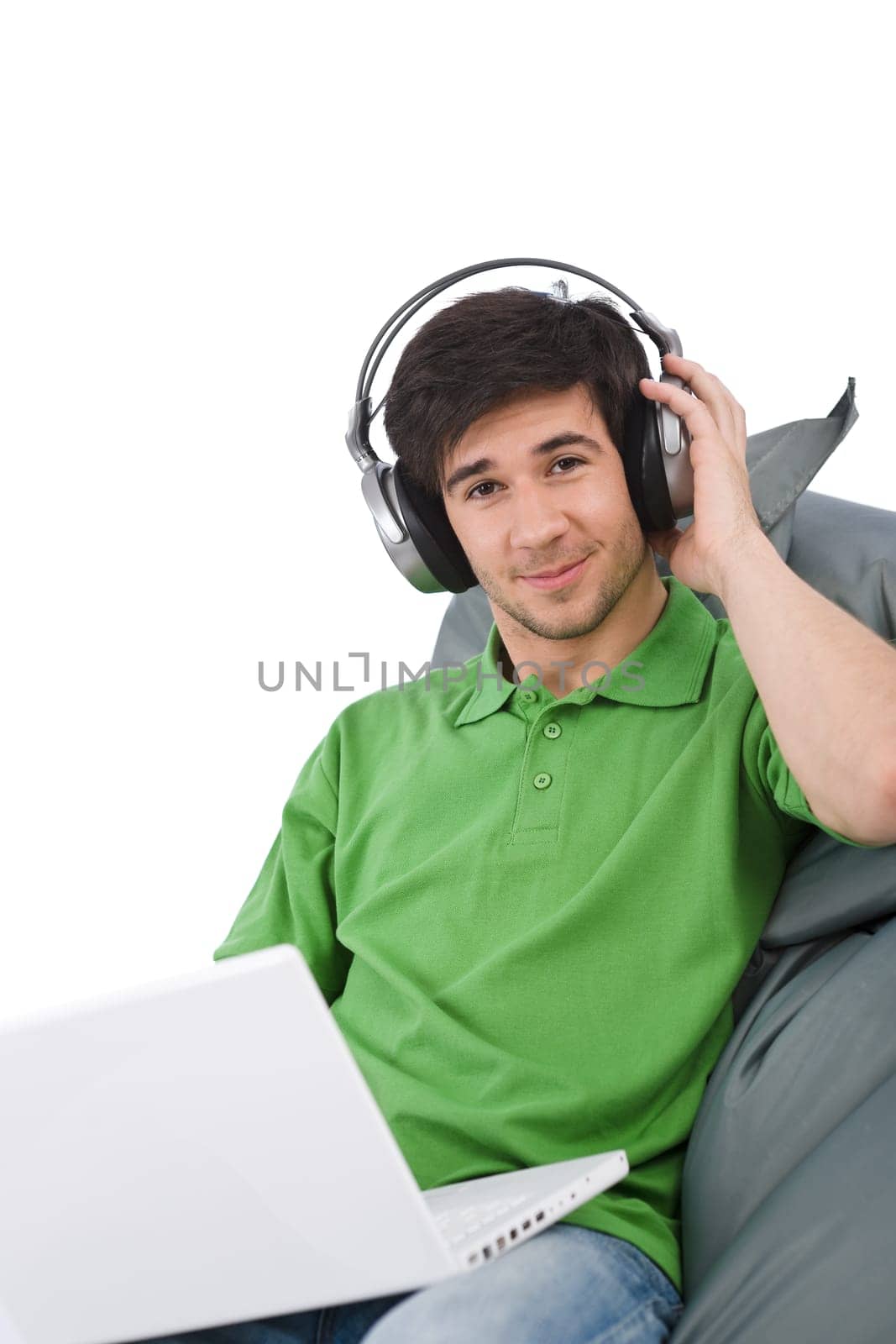 Young man with laptop and headphones