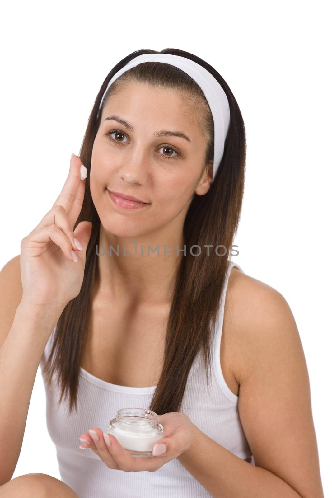 Beauty facial care - Young woman apply moisturizer