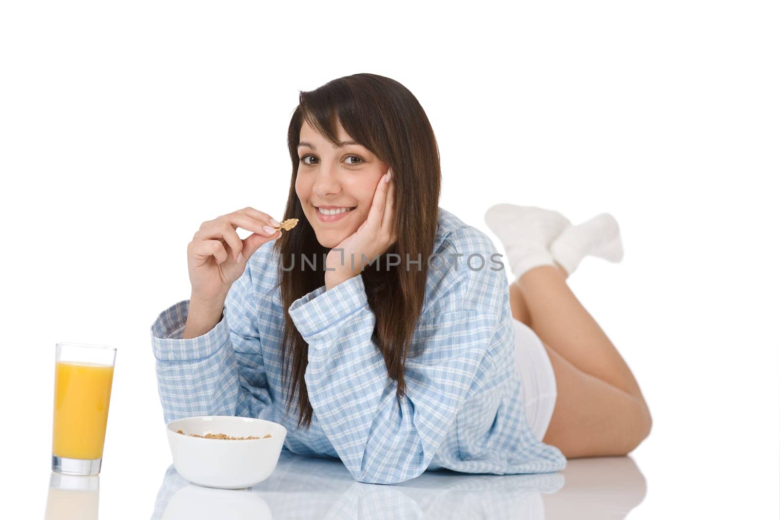 Smiling woman eat healthy cereal for breakfast