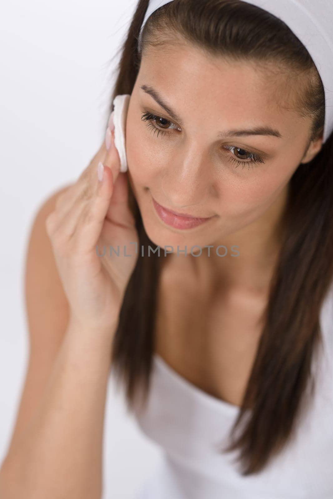 Beauty facial care - Teenager woman cleaning acne skin